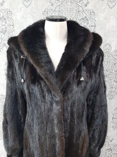 Unused mink fur coat with a hood size 12