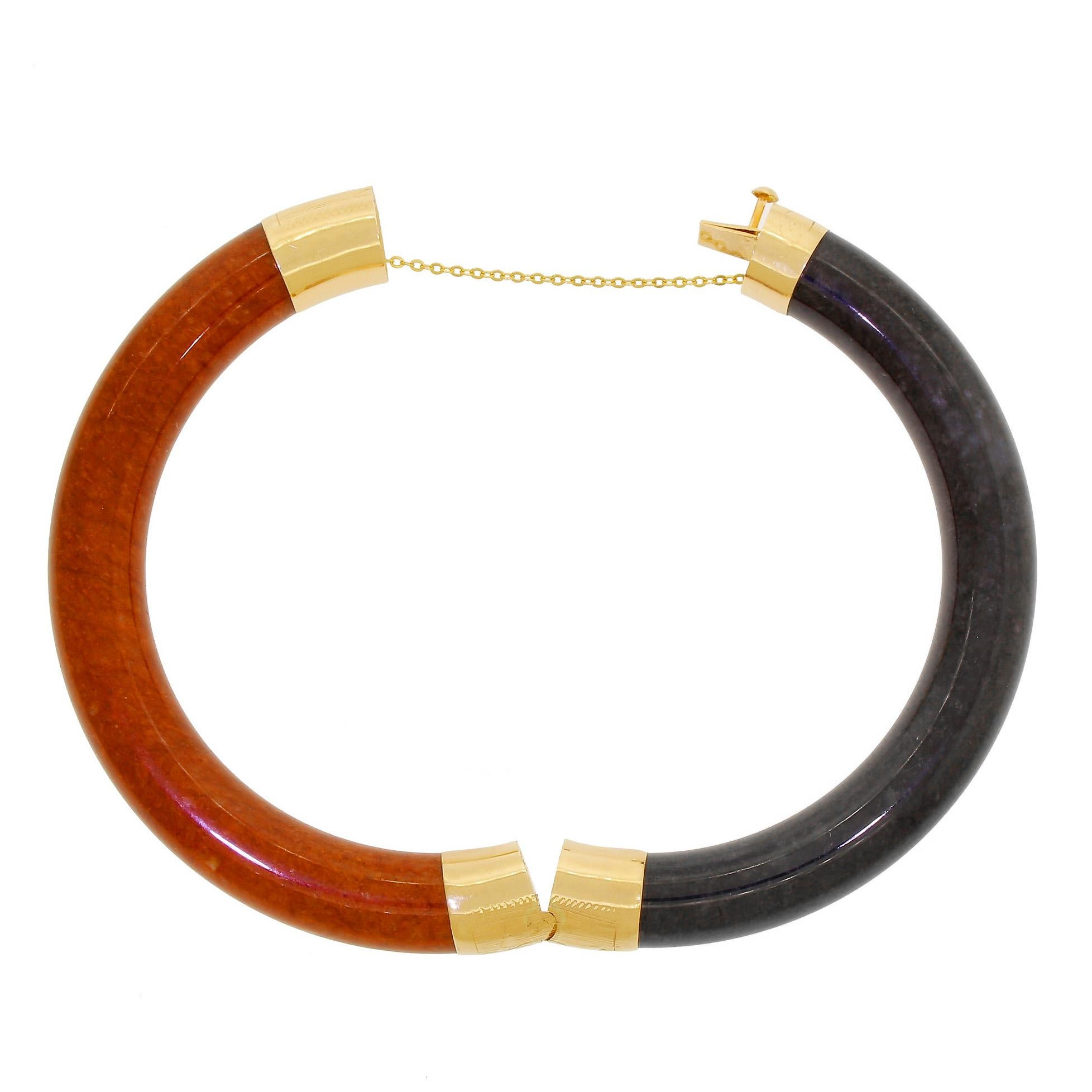 Vintage black & rust jade thick tube bangle bracelet with 14K yellow gold decorative engraved hinges and closure.
The tube varies slightly is size, between 9.6 and 9.9mm in diameter.
There are no chips, cracks or repairs to note.
Interior diameter
