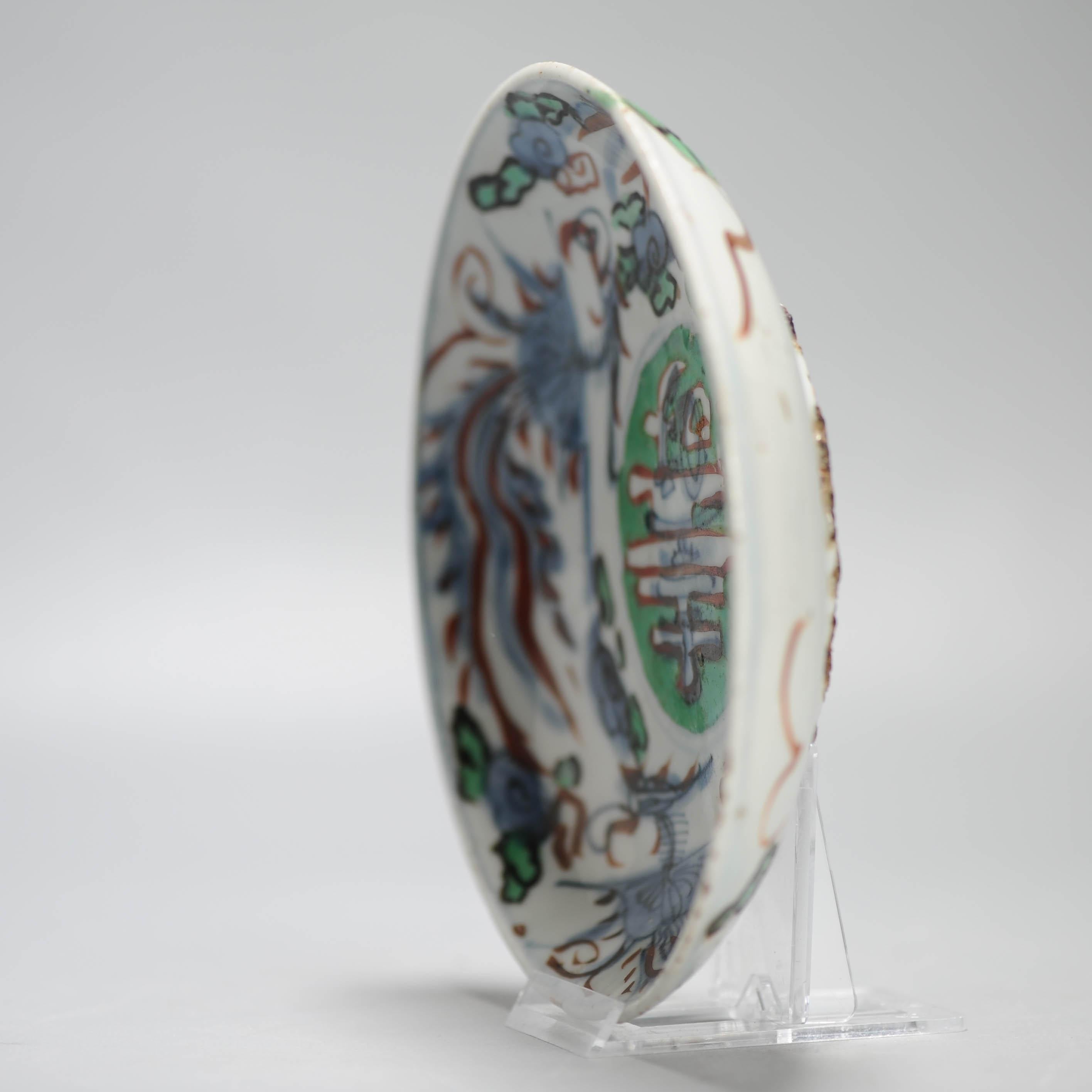 

Sharing with you this lovely and unusual Chinese porcelain plate from the late Ming period. Ealry 17th century Jingdezhen made for the Japanese market with rare added color.
Central a Shou character and the wall with Phoenixes.

Similar dish in