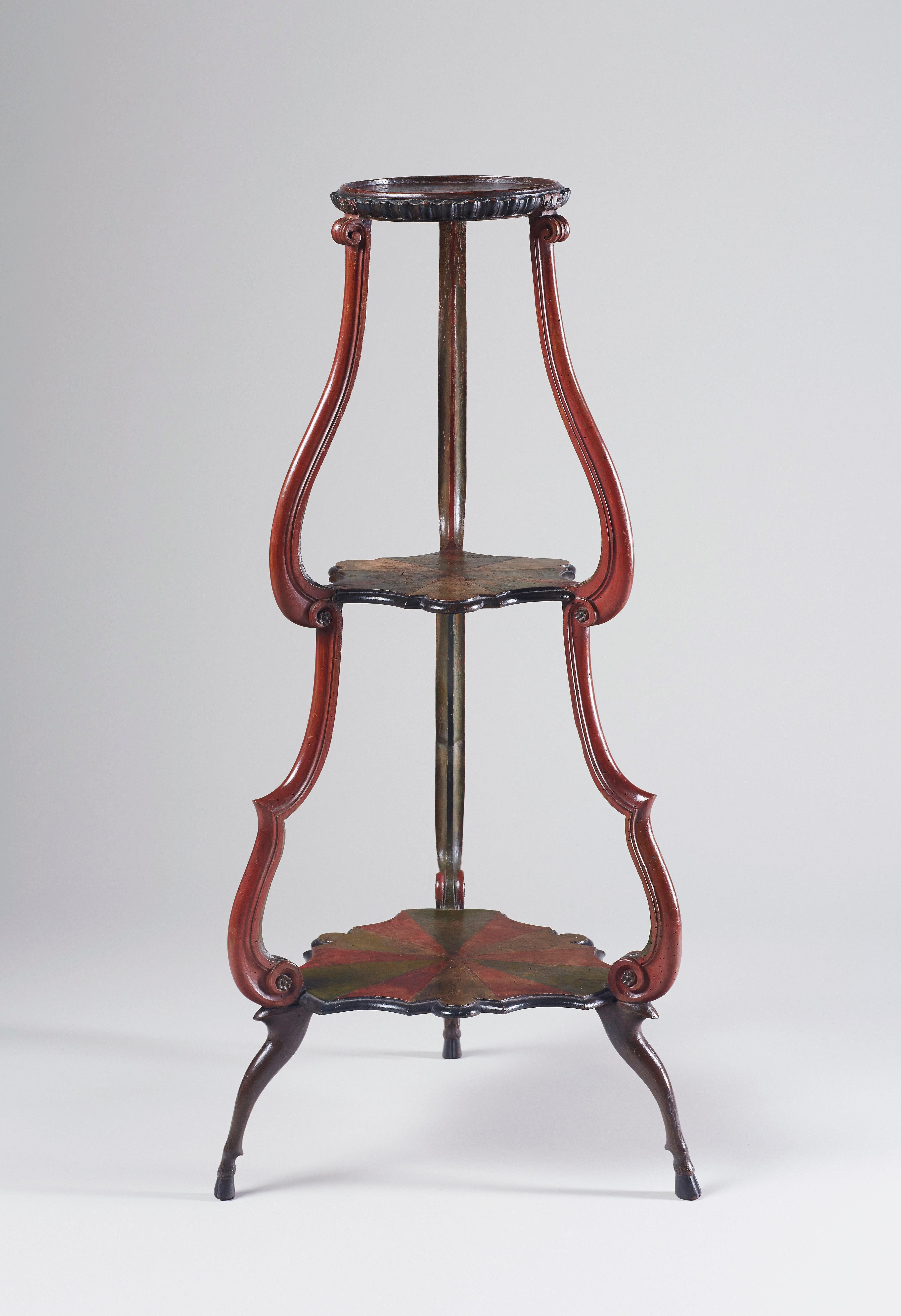 Unusual and very decorative three-tier étagère or guéridon of tapering form supported by three hoof feet. With its original polychrome paint.

This guéridon is very elegant with its subtle colourfulness, yet an unusual eye-catcher in any interior.