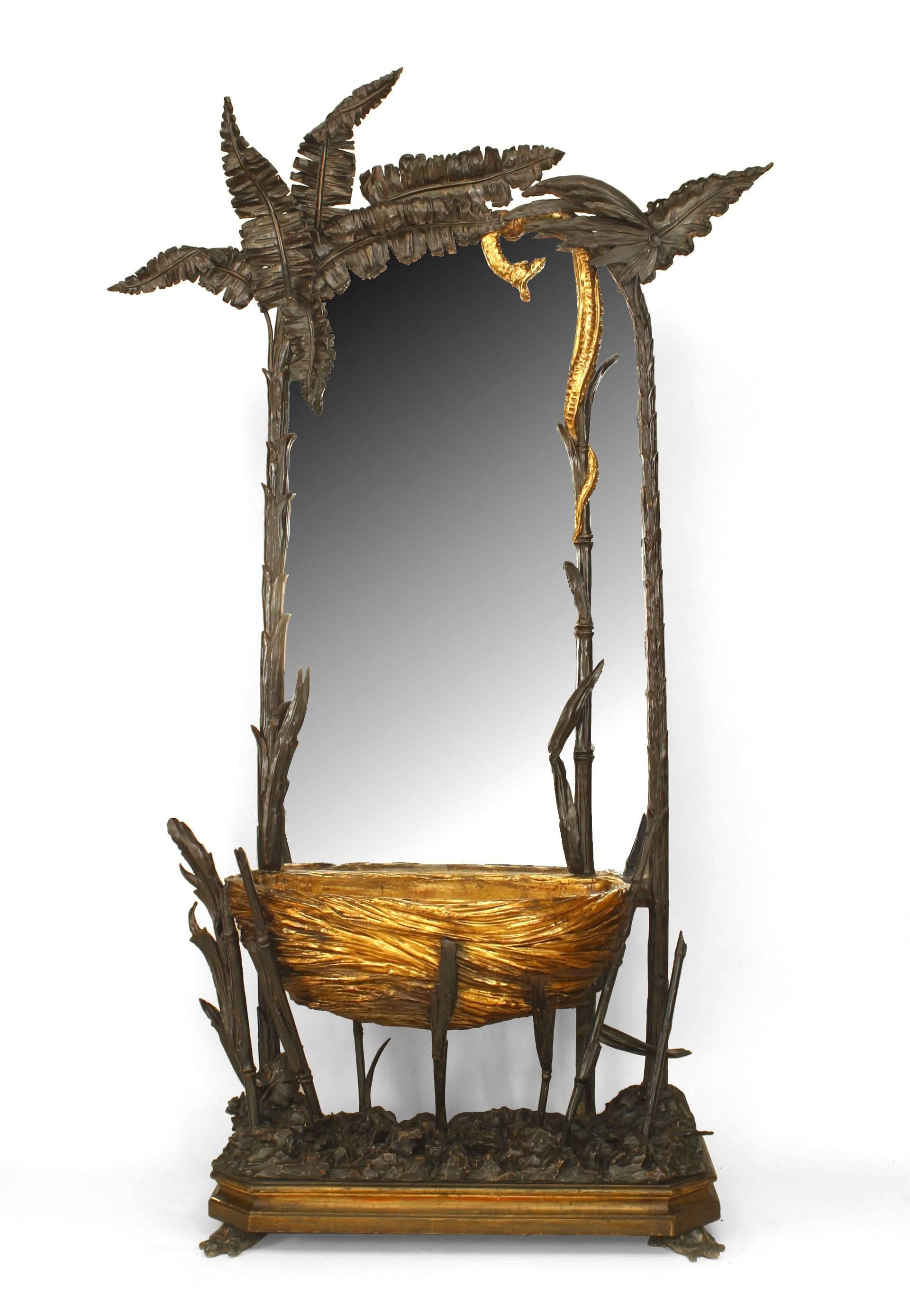 French (Napoleon III) naturalistic cheval mirror with a carved palm and fern design frame with a gilt snake and a carved gilt bird's nest planter basket on turtle feet.
 