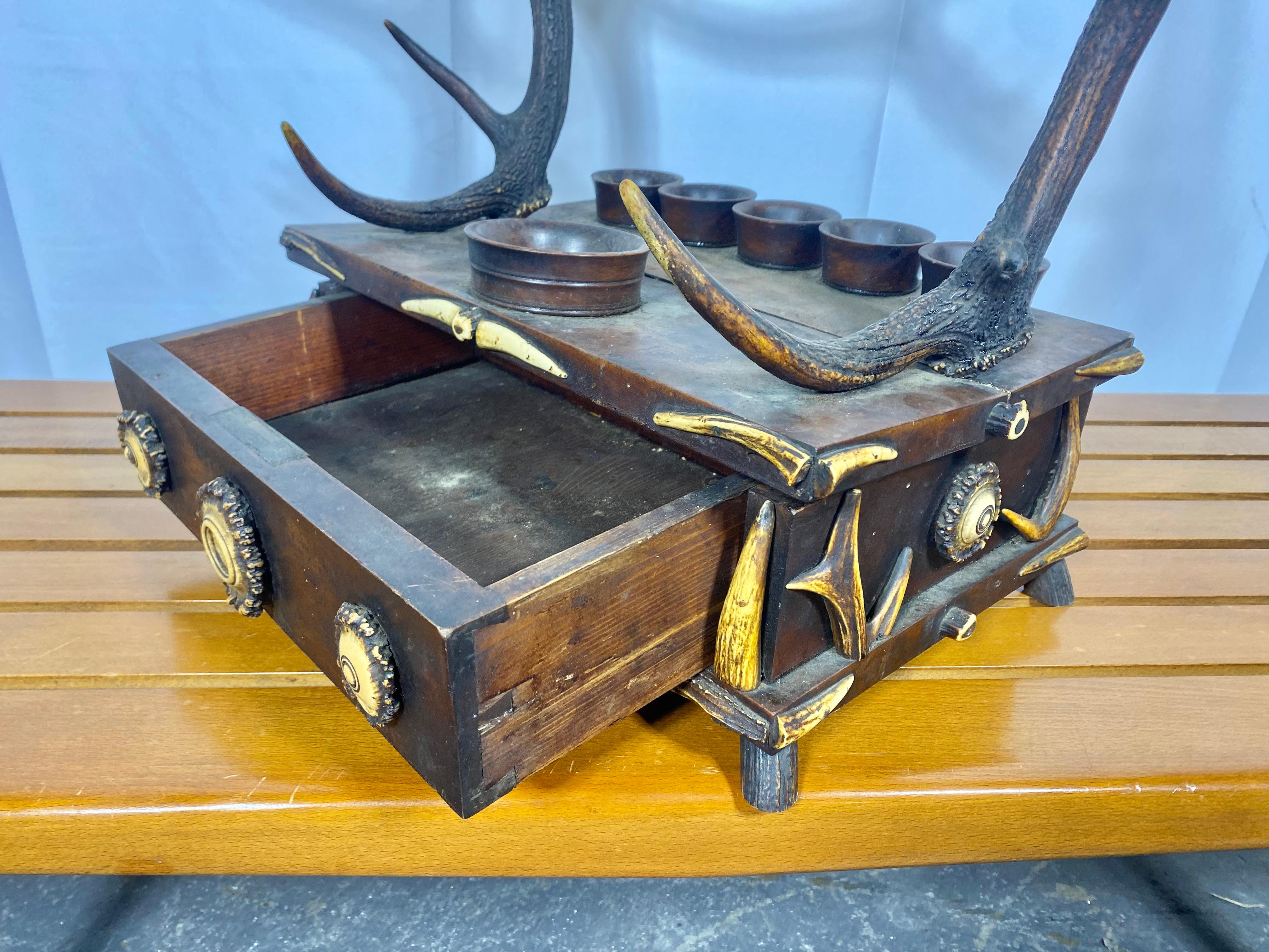 Unusual 19th Century Antler horn / oak German Valet, box with drawer, Center badge reads Weidmanns Heil..   Would make a wonderful dresser piece,, jewelry. trinket box,, Retains original finish . patina,, missing one horn (see photo) also small