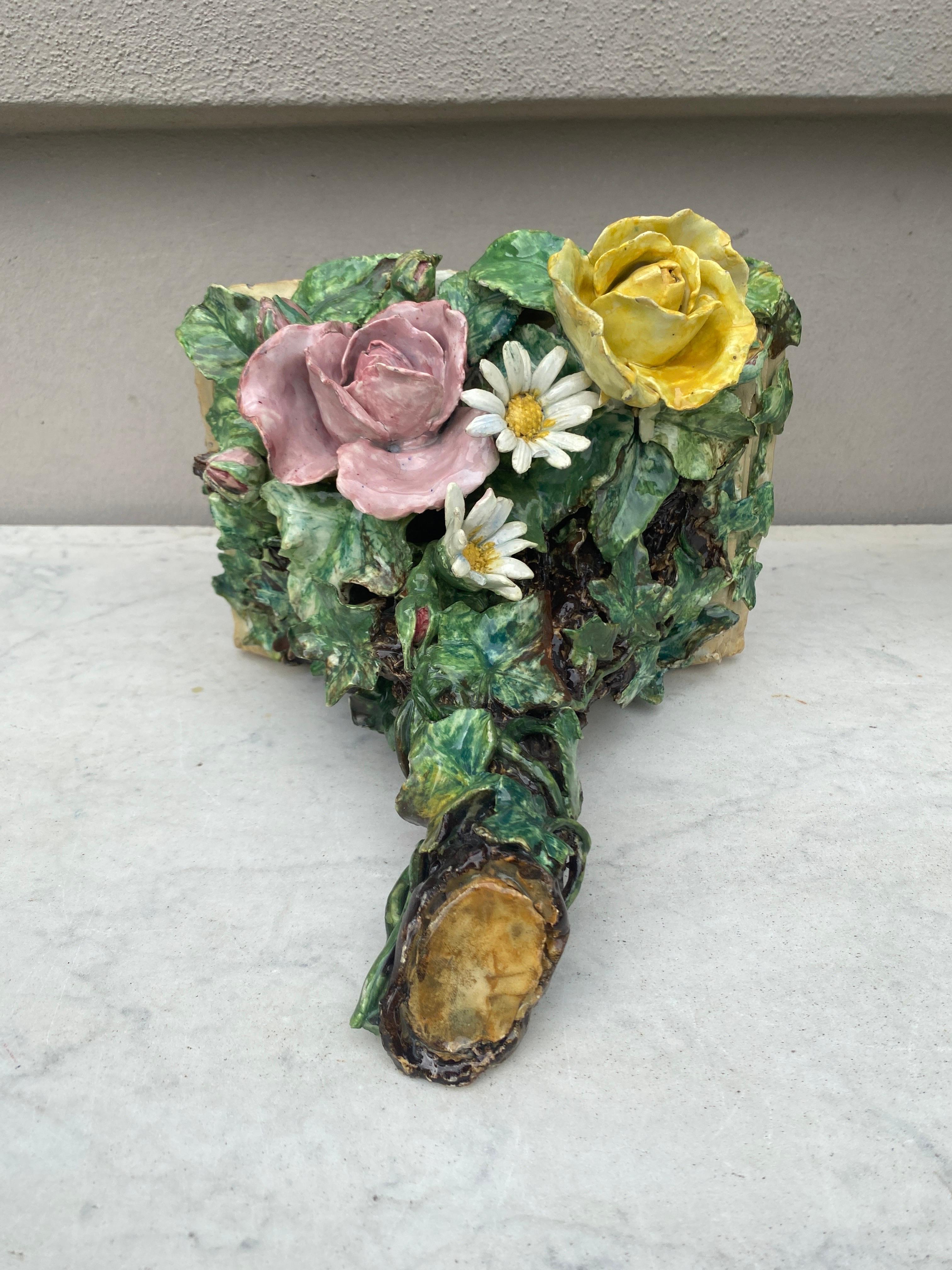 19th century French Majolica sconce with roses and daisies.
