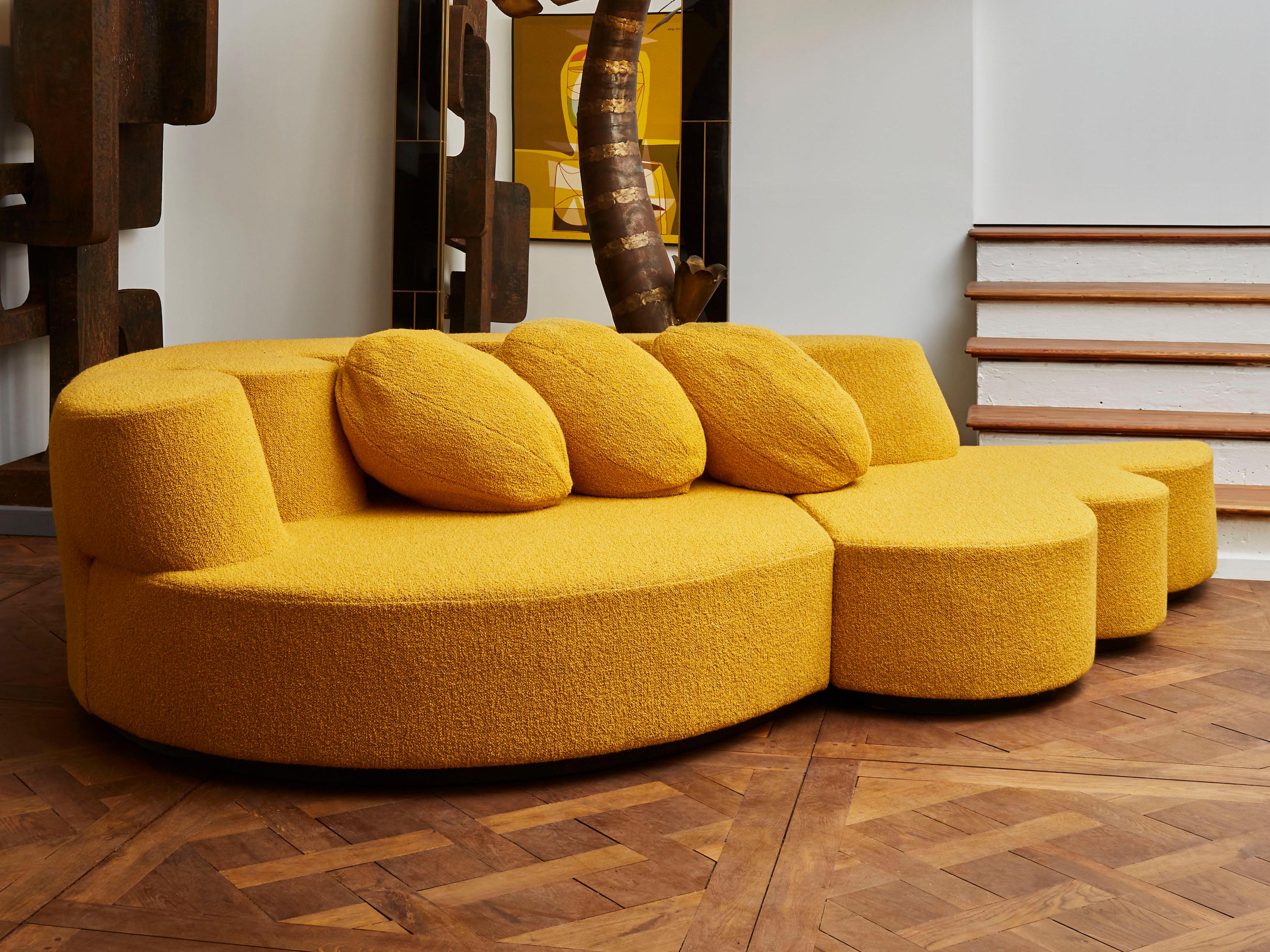 Exceptional vintage sofa in 2 parts with custom made cushions, entirely restored and reupholstered with a mustard bouclette fabric by Nobilis.
France, 1970s.