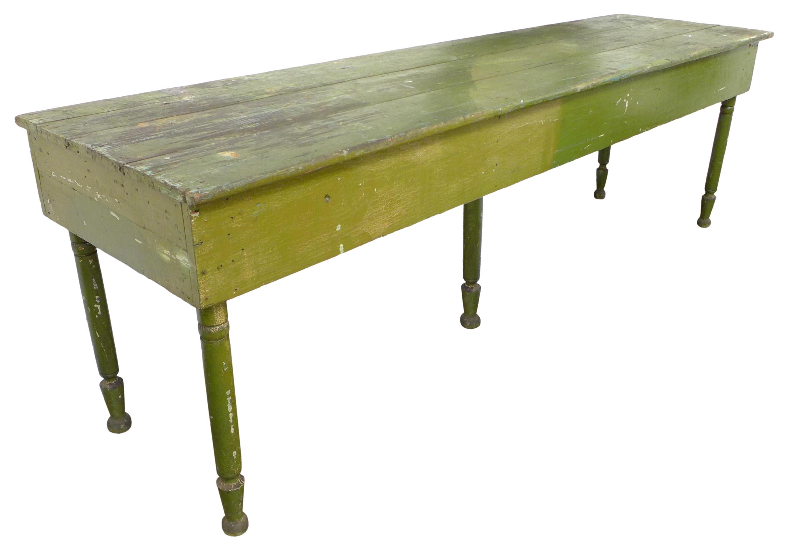 A wonderful and unusual, rustic 5-legged painted wood console or work table. Great extra long scale and gradient green surface beautifully worn from years of use. Remains structurally strong and functional. A rare and evocative vintage Americana