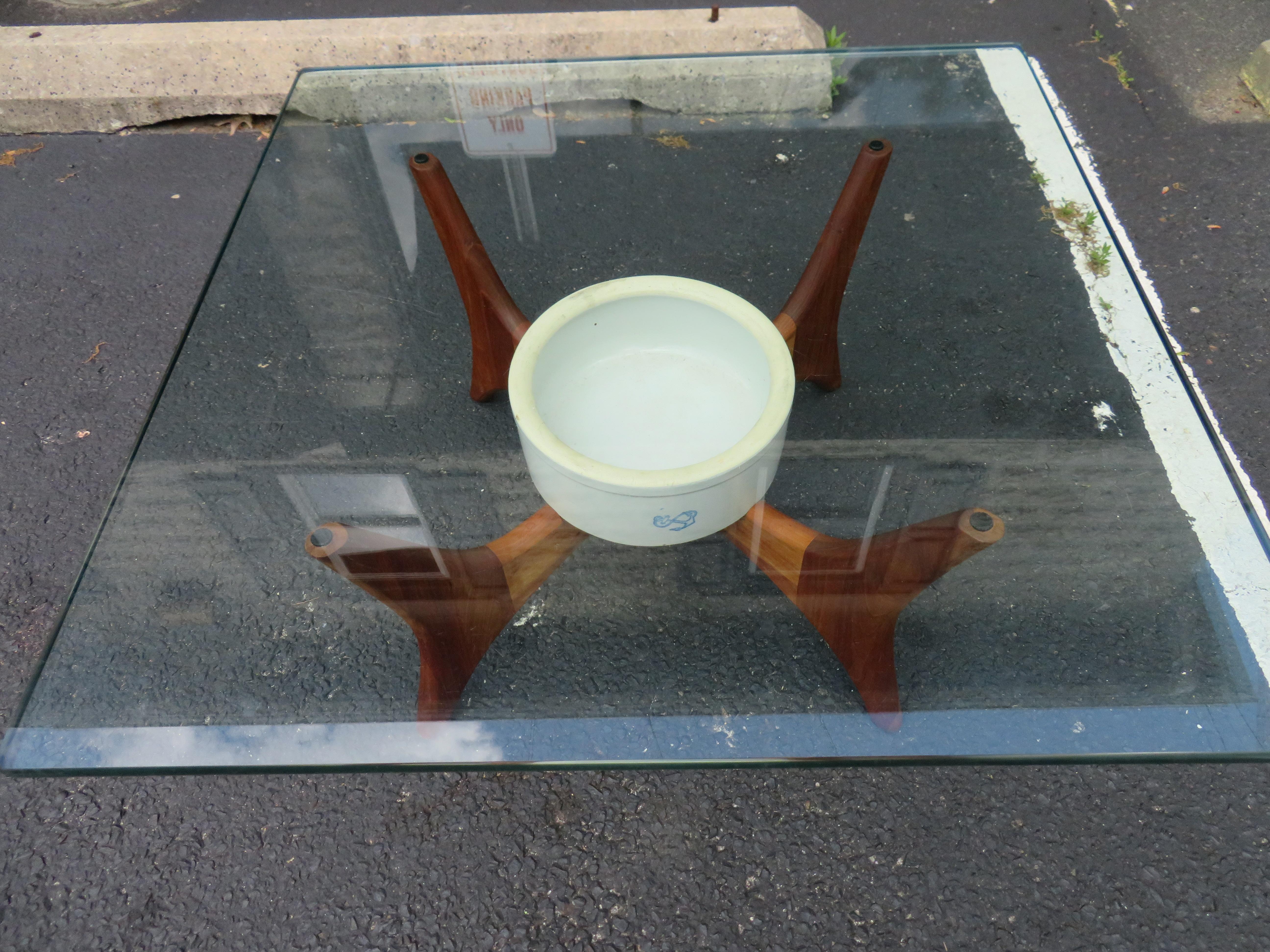 Unusual Adrian Pearsall sculptural walnut coffee table with crock planter. This table has a light walnut finish and very nice heavy crock bowl planter. We are not sure the crock is original but it looks perfect and is a period piece.