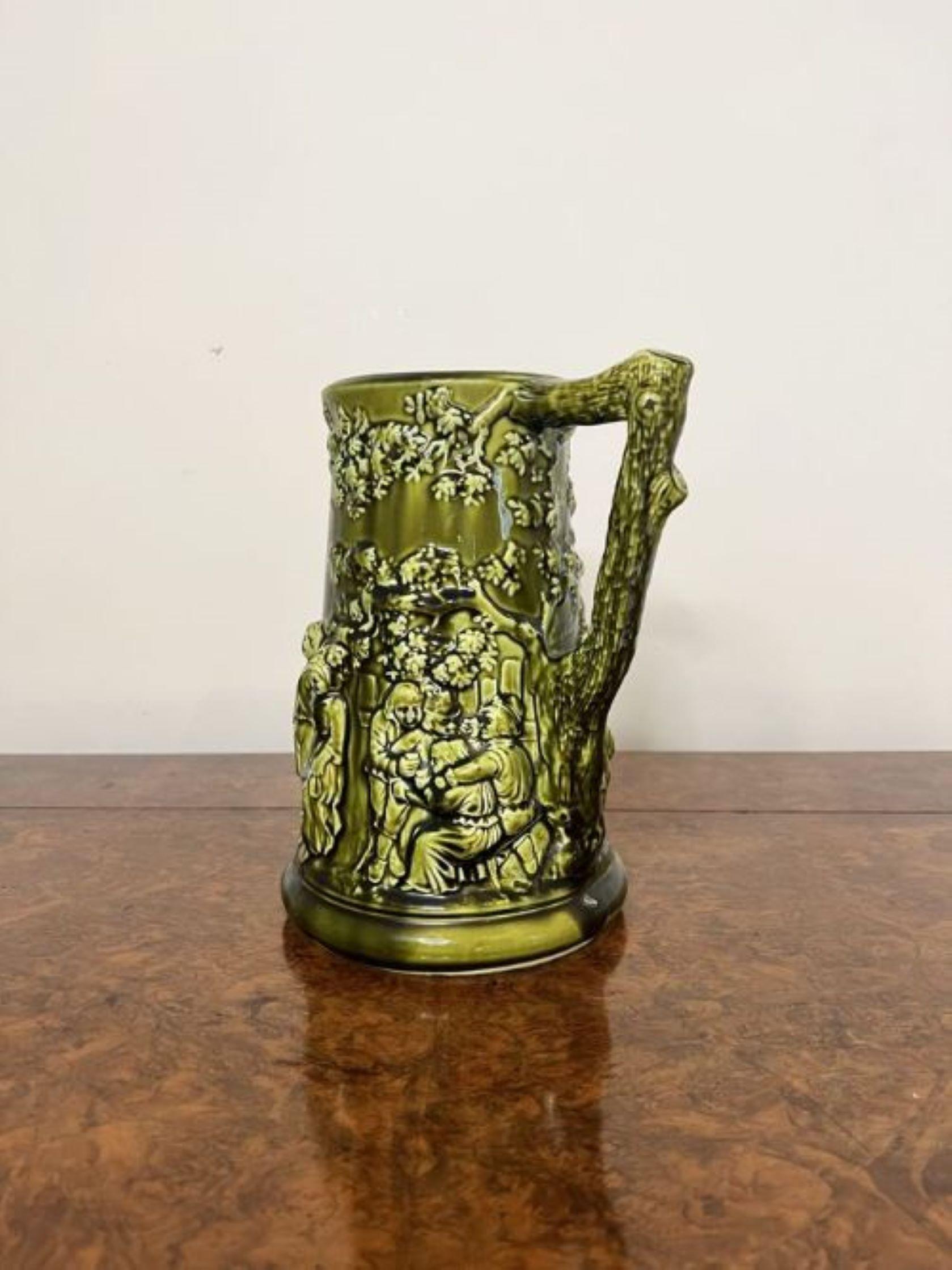 Unusual antique Edwardian quality majolica jug having wonderful detailed decretive figural scenes a shaped handle to the back in a beautiful green colour and blue to the inside.