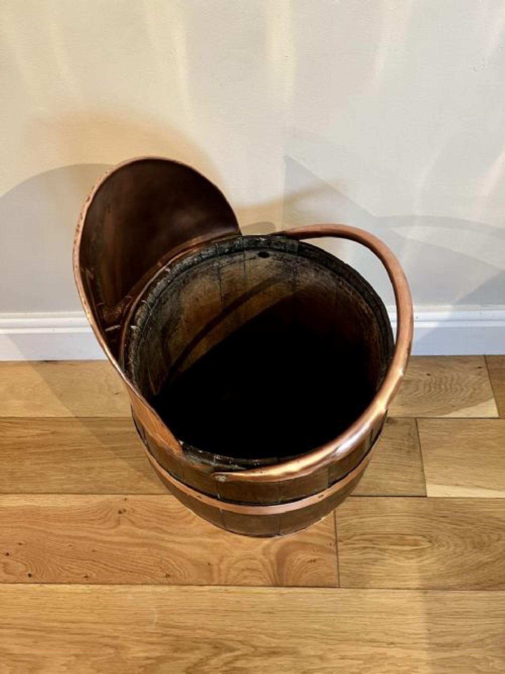 Unusual antique Edwardian quality oak copper bounded coal bucket having a quality oak coal bucket with copper bounds with a copper swing carrying handle to the top 