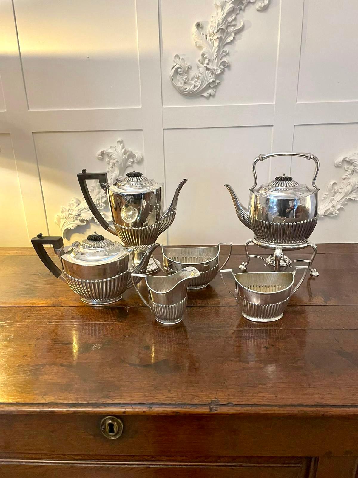 Unusual Antique Edwardian quality silver plated 6 piece tea set having a quality antique Edwardian 6 piece silver plate tea set consisting of a teapot, coffee pot, spirit kettle on stand, two sugar bowls and a milk jug 

In lovely original