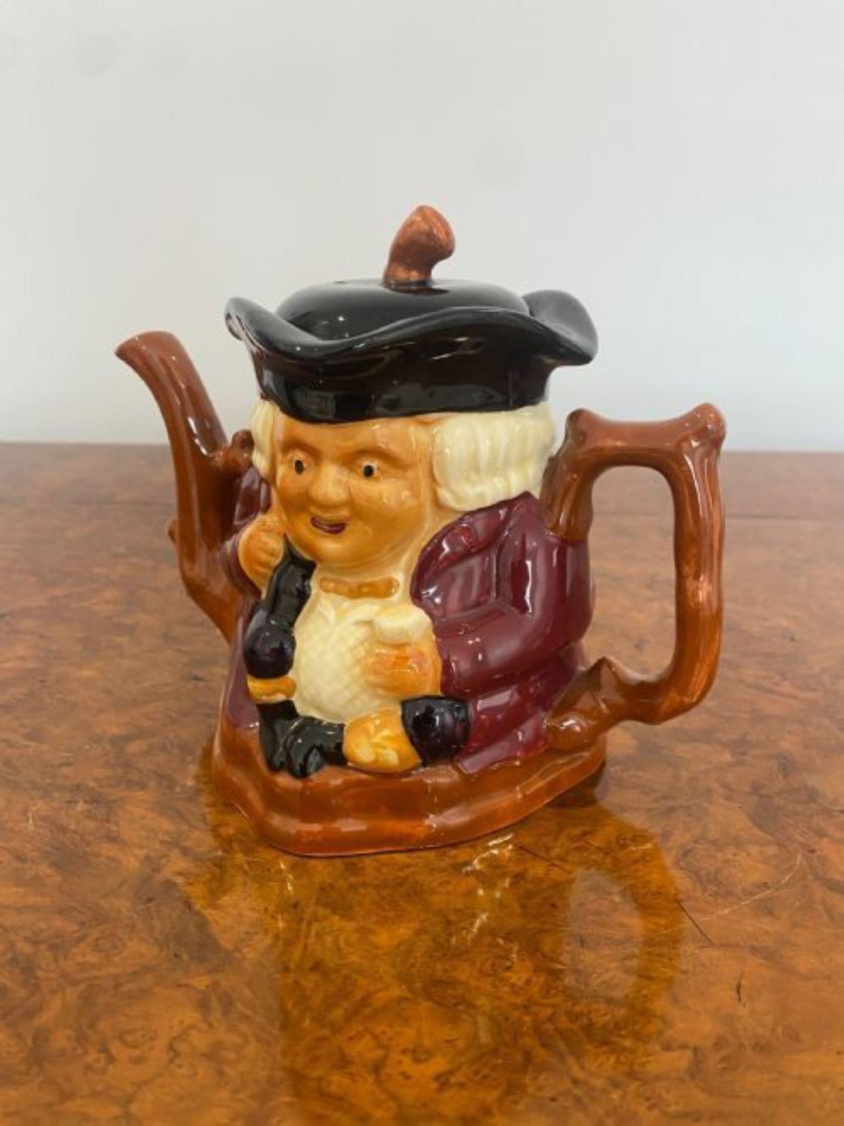Unusual antique Edwardian toby jug teapot having a quality teapot with a man sitting down, shaped handle and spout and original lid.