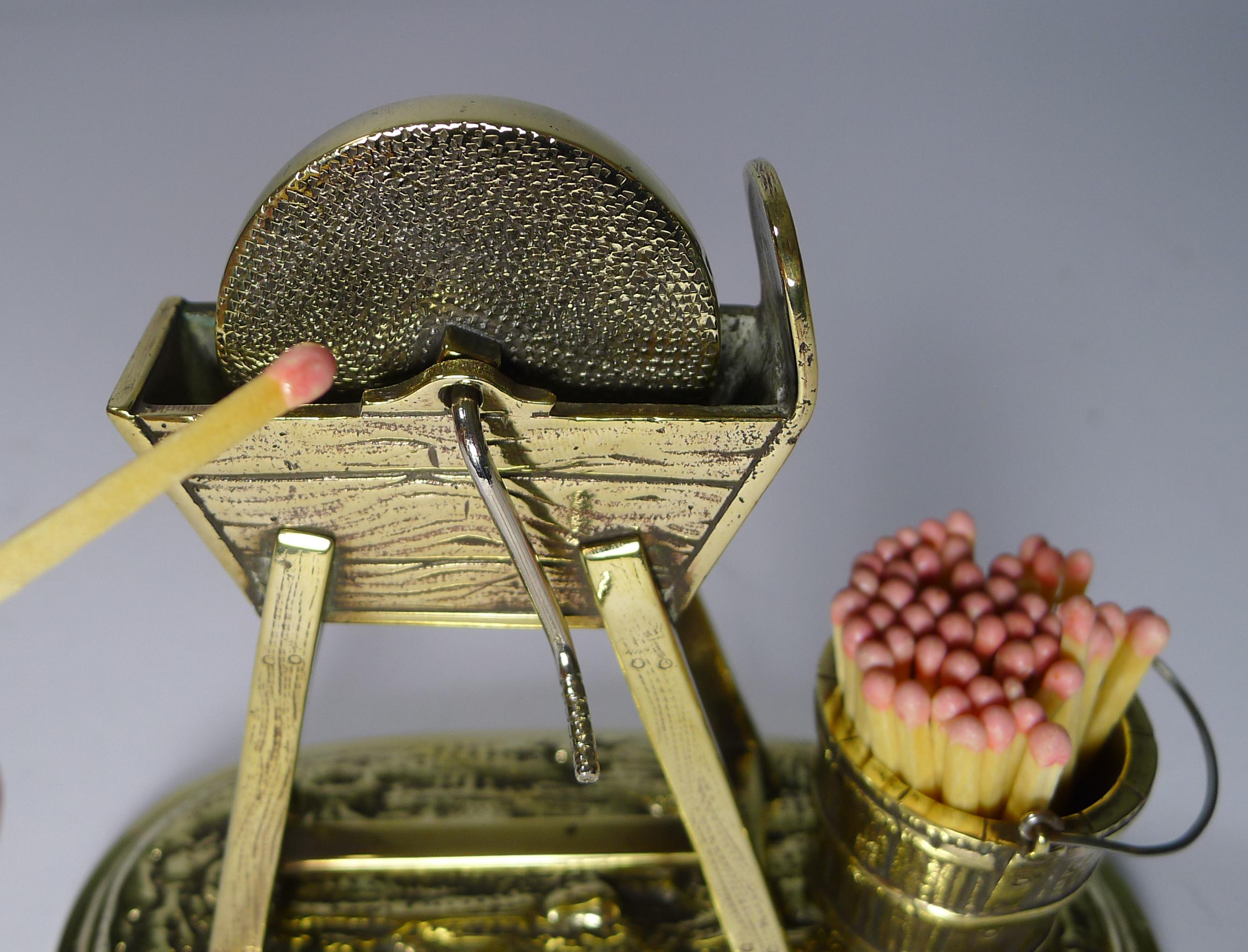 A wonderful and most unusual novelty match strike made from cast brass and just back from a professional clean and polish by our silversmith.

The non-safety matches (the ones shown for photographic purposes only) would sit in he coopered bucket