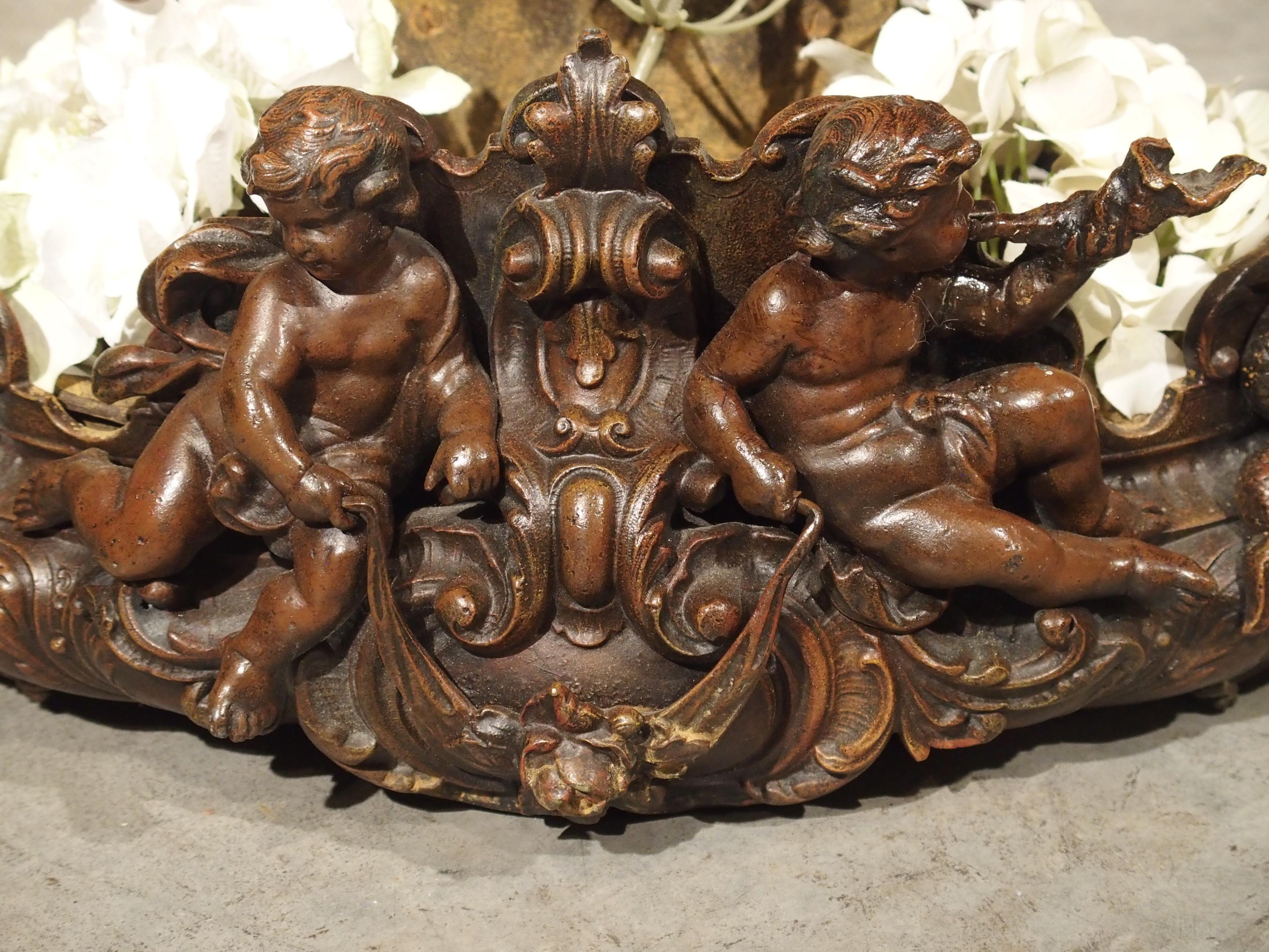 This ornate French jardinière featuring mythological creatures was cast in bronze and is in the style of Louis XV. The main decorative elements of the jardinière include two sets of putti and a pair of hippocampi. A hippocamp is a mythological