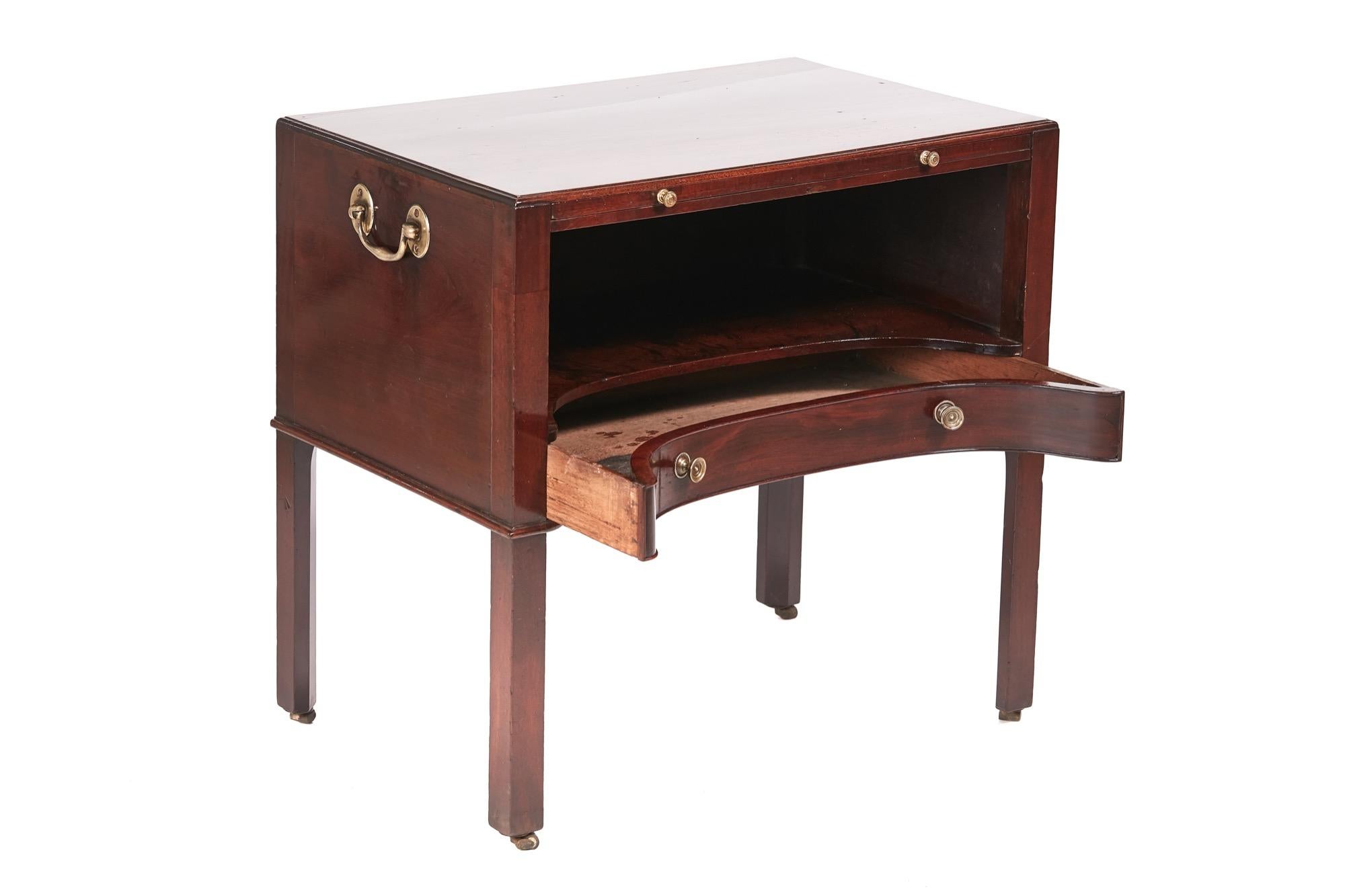 This is an unusual George III antique mahogany bedside table with a lovely quality mahogany shaped top. It boasts a brushing slide and a shaped drawer with original brass carrying handles. It stands on four elegant square chamfer legs with original
