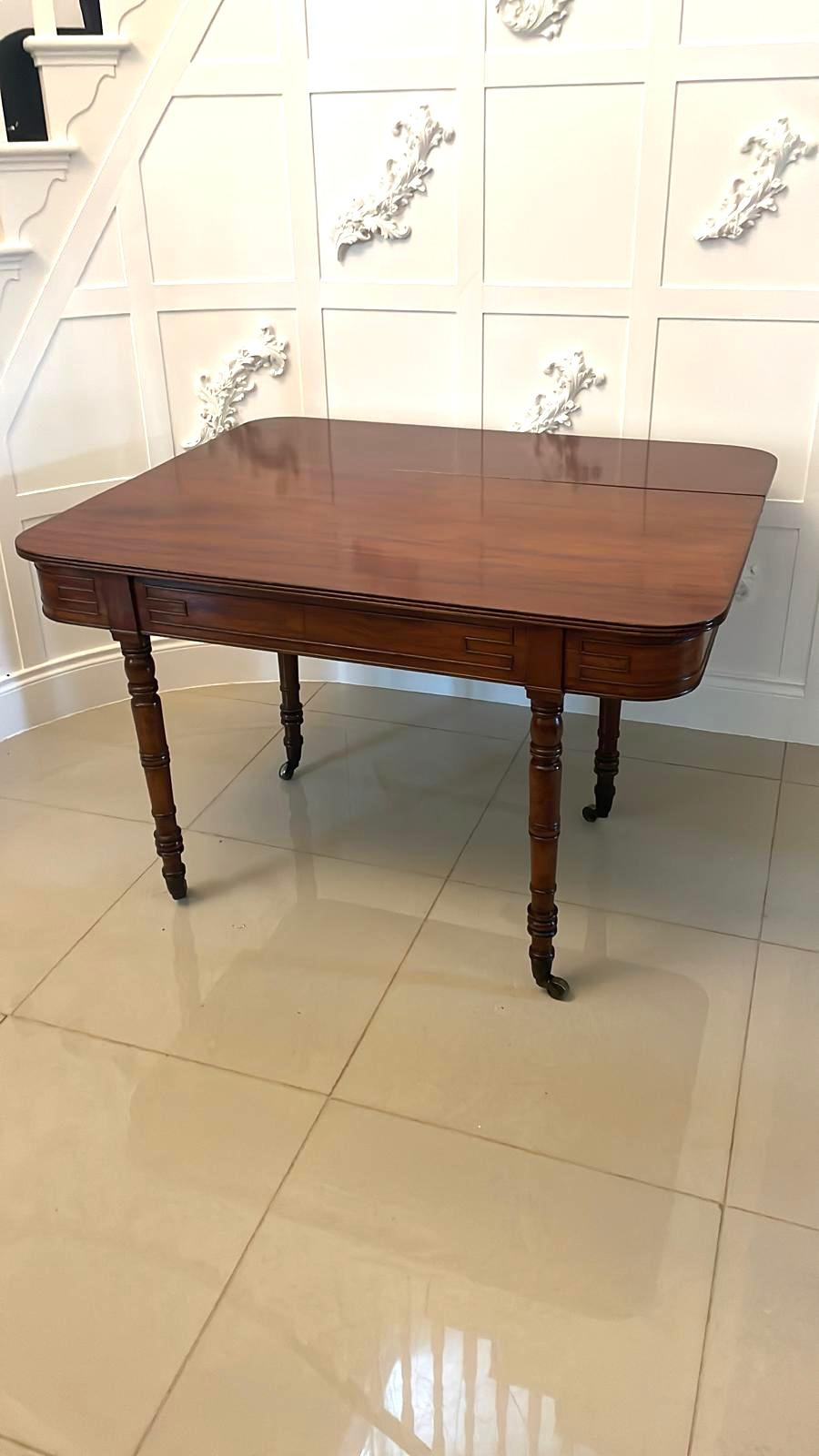 Unusual Antique George III quality mahogany console table having a quality figured mahogany top with a drop leaf making a centre or dining table with a reeded edge, mahogany frieze with Greek key beading standing on four turned tapering legs with