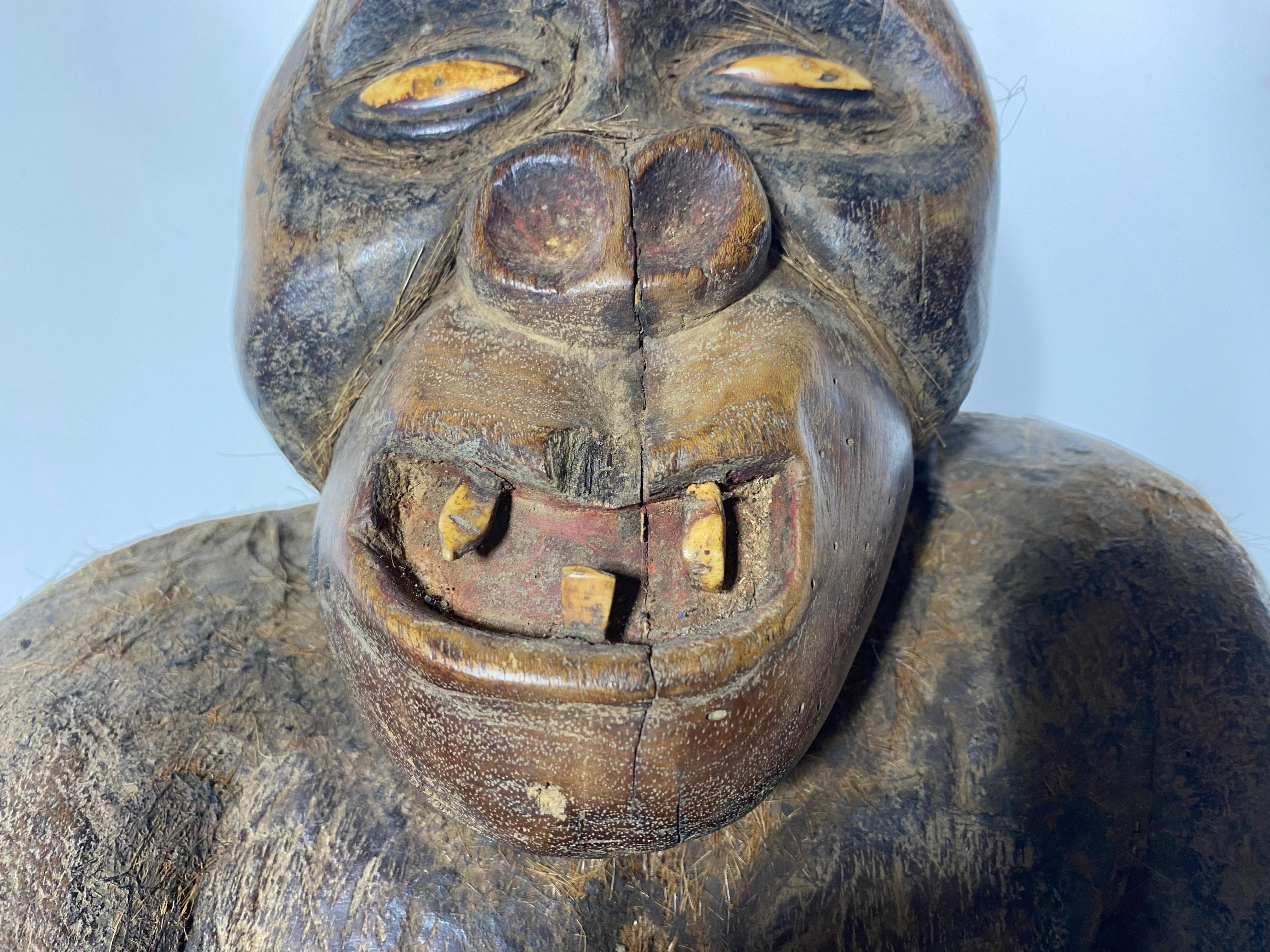 Unusual Antique Hand Carved African Fertility Primate / Baboon, Gorilla,, Extremely well executed,, all hand carved,, remnants of original hair, bone eyes and teeth detail. 