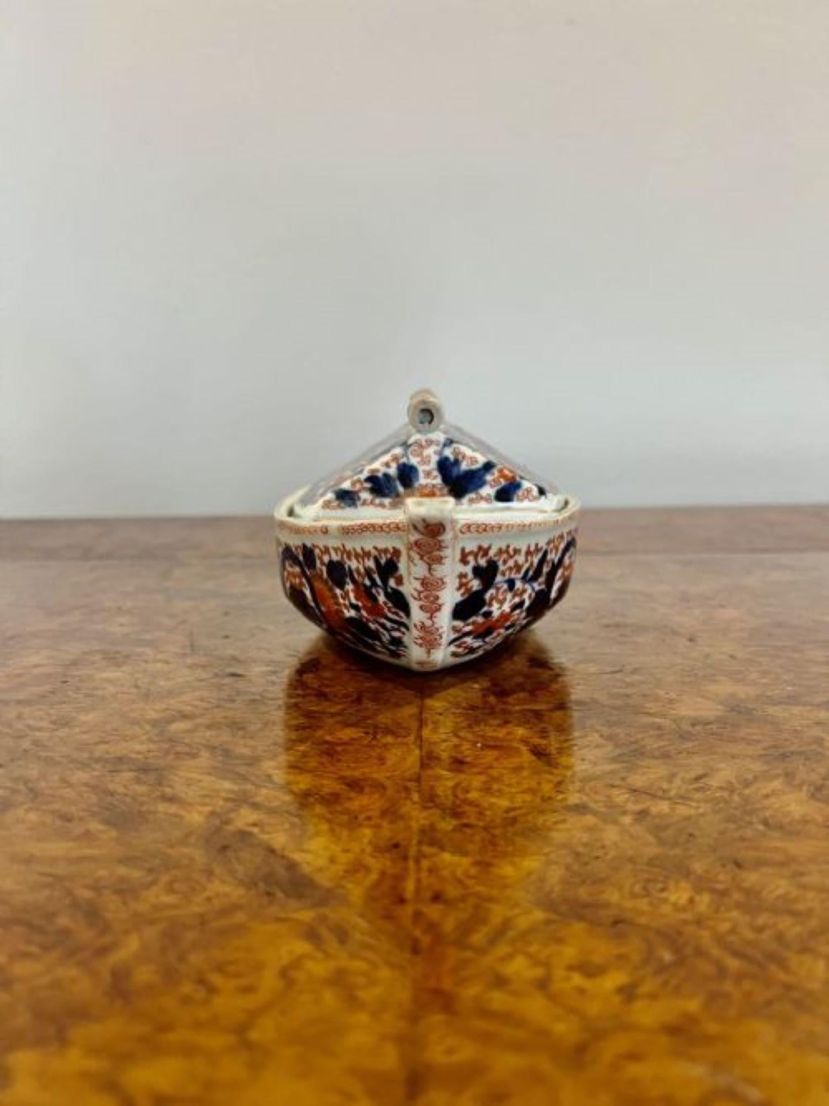 Unusual antique Japanese imari quality boat shaped dish having an unusual antique Japanese imari boat shaped dish with a removable lid revealing a storage compartment, decorated with flowers, leaves and scrolls in wonderful hand pained red, blue,