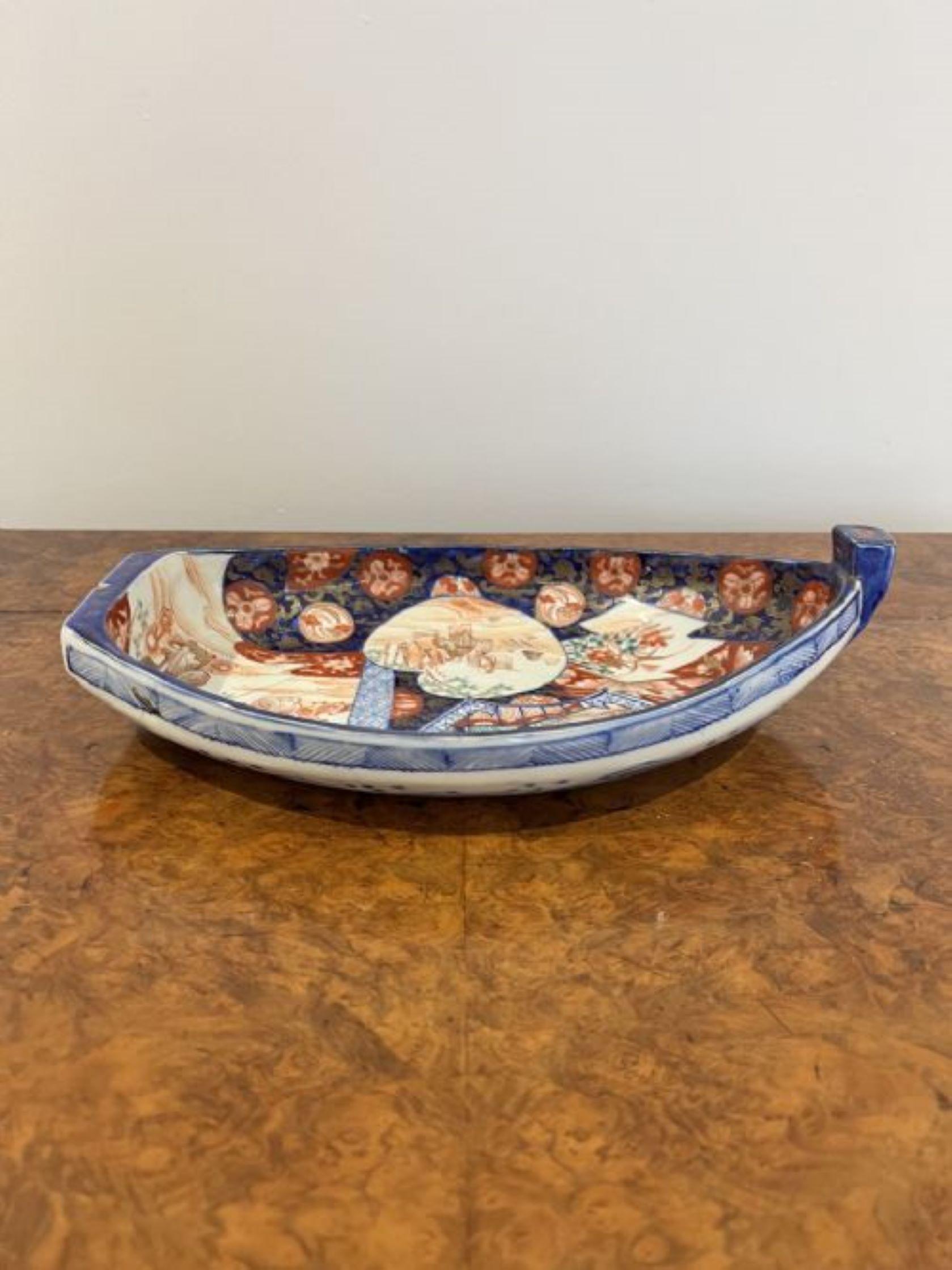Unusual antique Japanese quality Imari boat shaped dish having a quality antique Japanese Imari boat shaped dish with fantastic hand painted panels in wonderful gold, red, green, blue and white colours 
has been restored as shown 