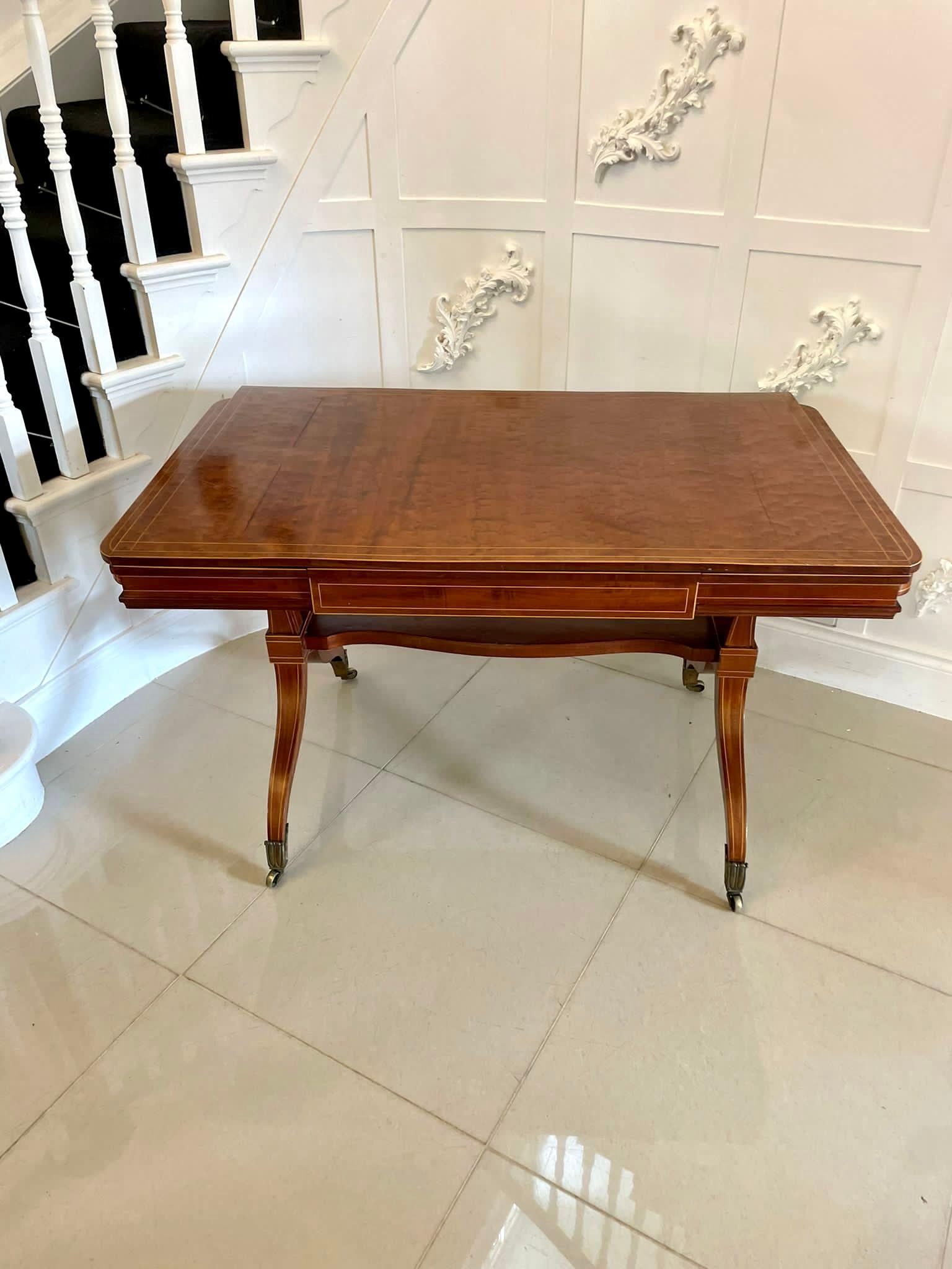 Unusual Antique Regency quality mahogany and satinwood inlaid freestanding sofa/dining table having a fantastic quality mahogany top with inlaid satinwood stringing with two unusual sliding leaves, mahogany frieze with inlaid satinwood stringing