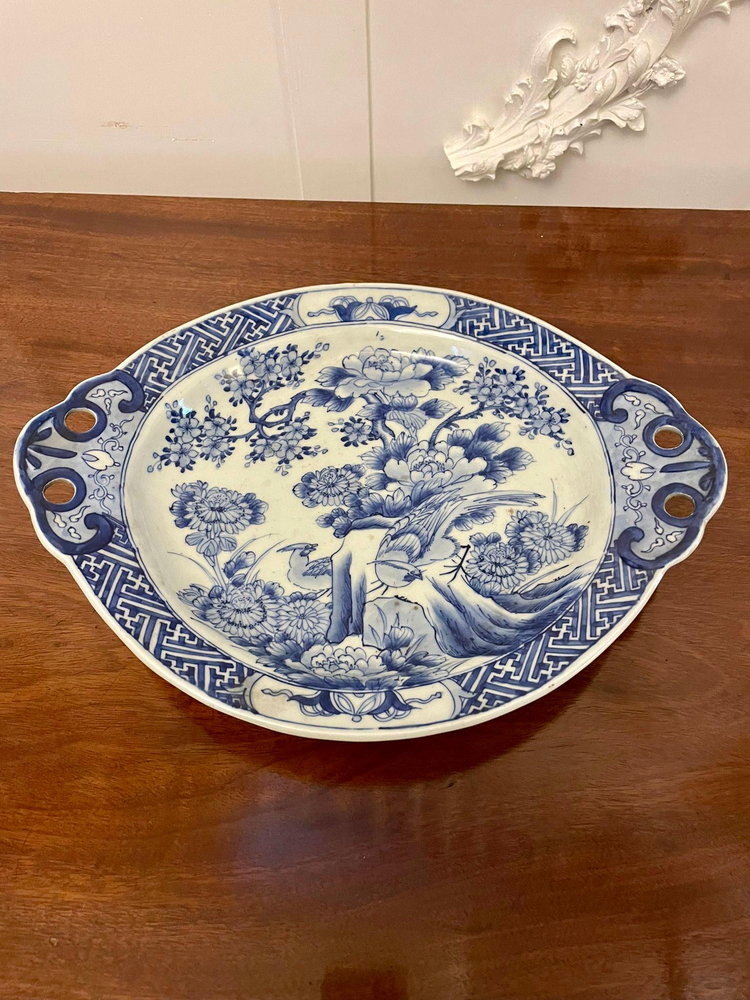 Unusual Antique quality Japanese blue and white Imari dish having a quality antique Japanese blue and white Imari dish decorated with birds, trees, flowers and boasting lovely shaped handles. 

A charming example In lovely original