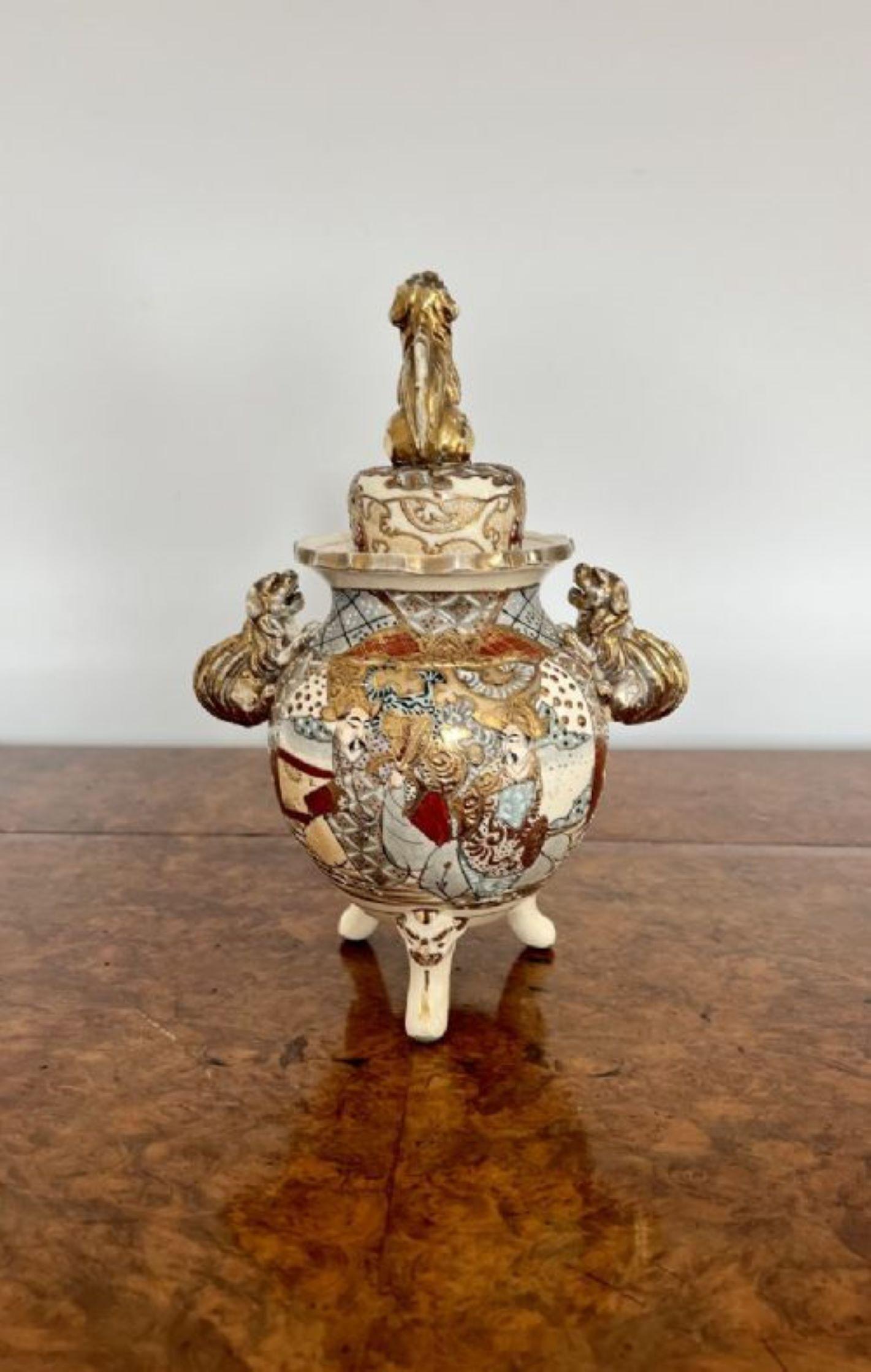 Unusual antique quality Satsuma vase & cover having an unusual satsuma vase with a lift off lid with a gilded dog above a circular shaped vase raised on three legs, two gilded dogs as side handles with wonderful hand painted panels in wonderful red,
