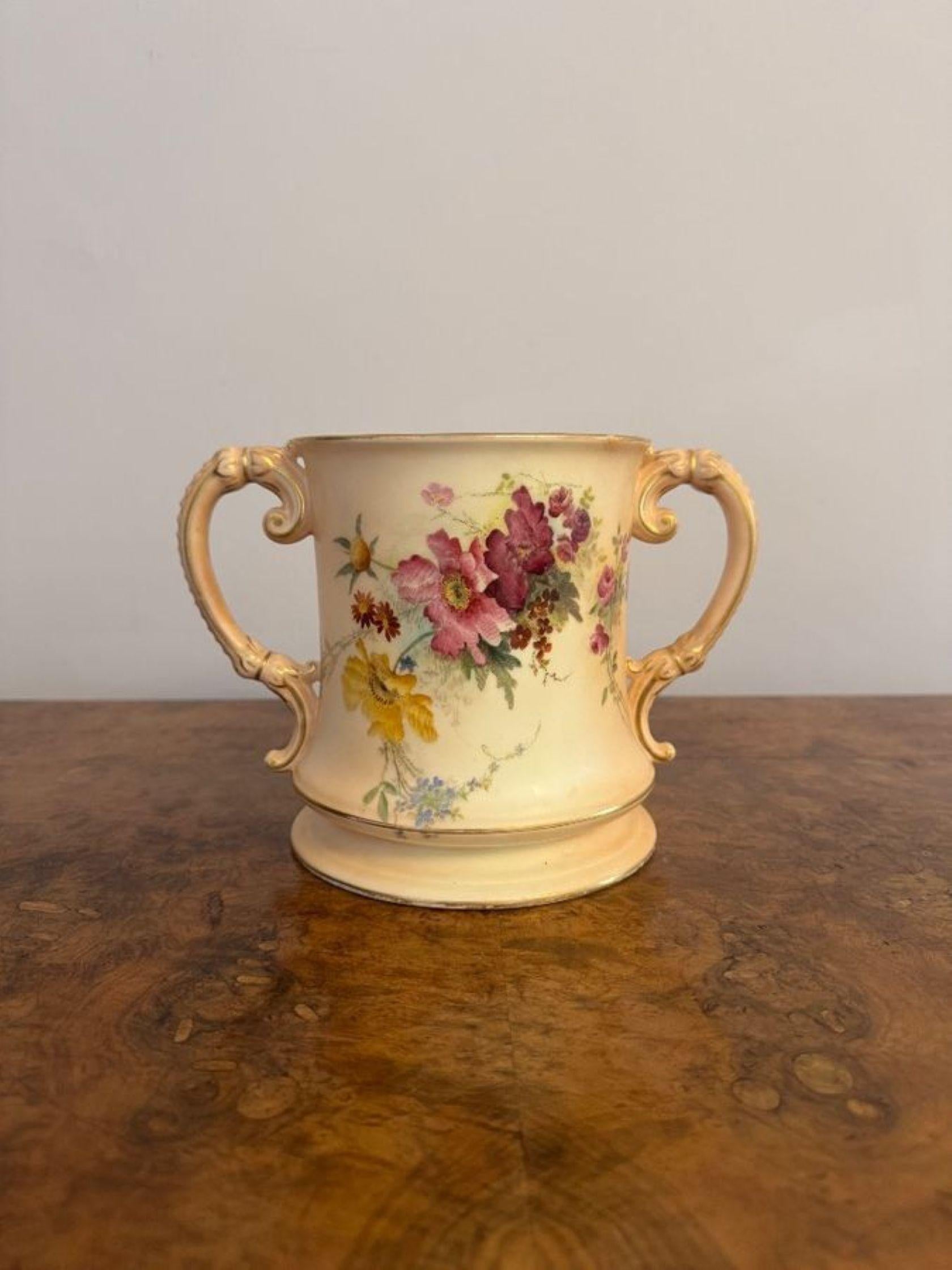 Unusual antique Royal Worcester loving cup, having an unusual large antique Royal Worcester loving cup with a pair of shaped handles to the sides, decorated with beautiful flowers in stunning red, blue, yellow and green colours on a yellow ground