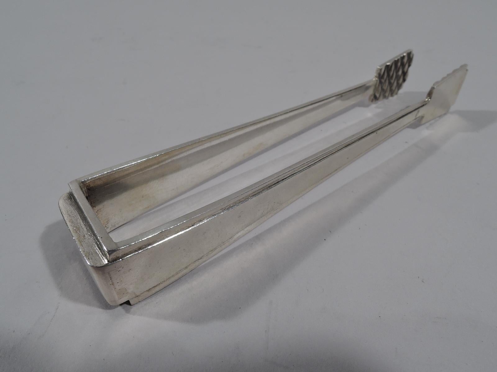 Unusual Antique Russian 875 silver sugar tongs. Stepped and rectilinear frame; jaws trapezoidal with raised diaper interior. Marked. Weight: 2.5 troy ounces.