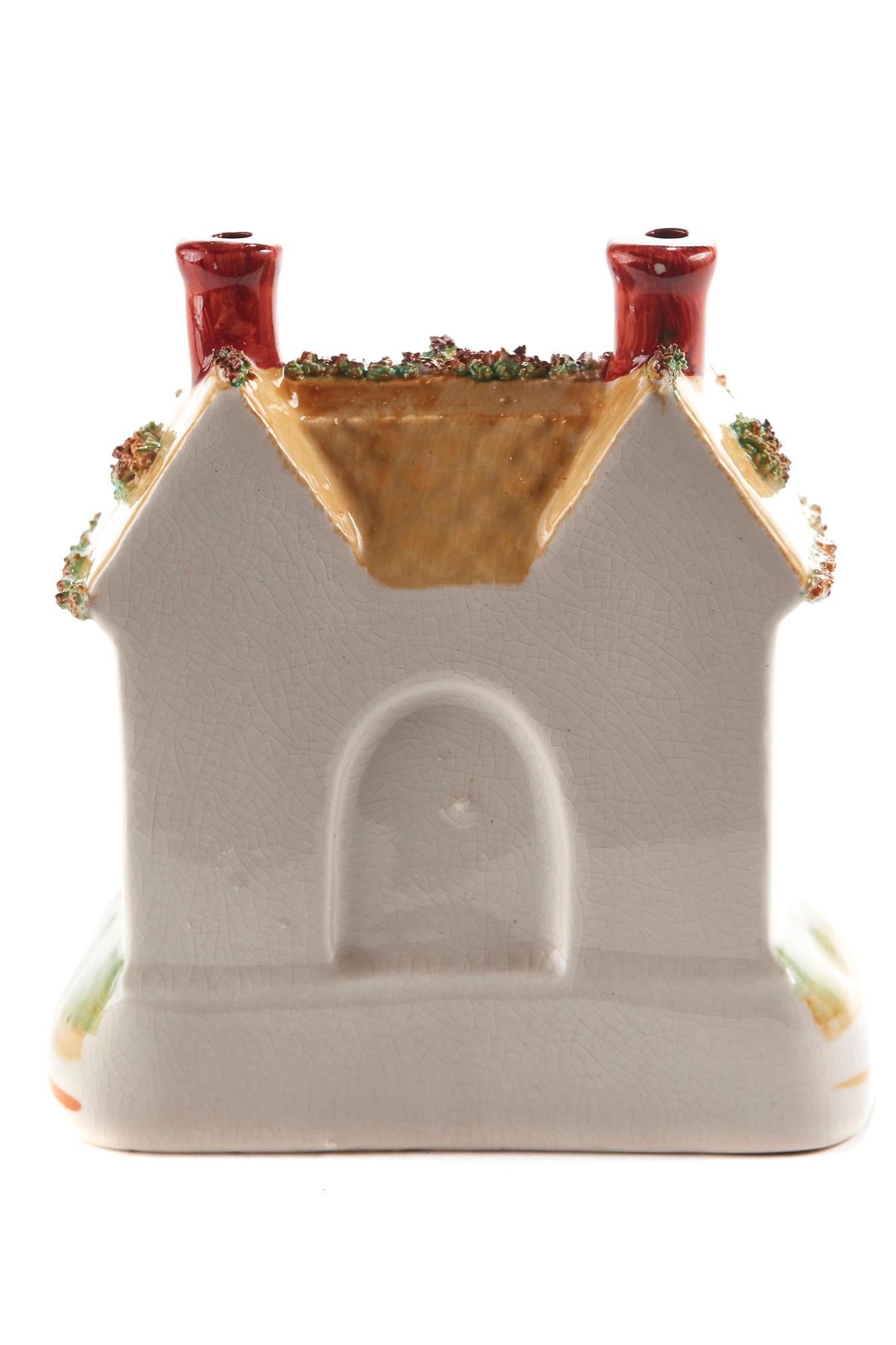 This is an unusual 19th century antique Staffordshire Cottage, lovely colorful cottage. It is in perfect condition.