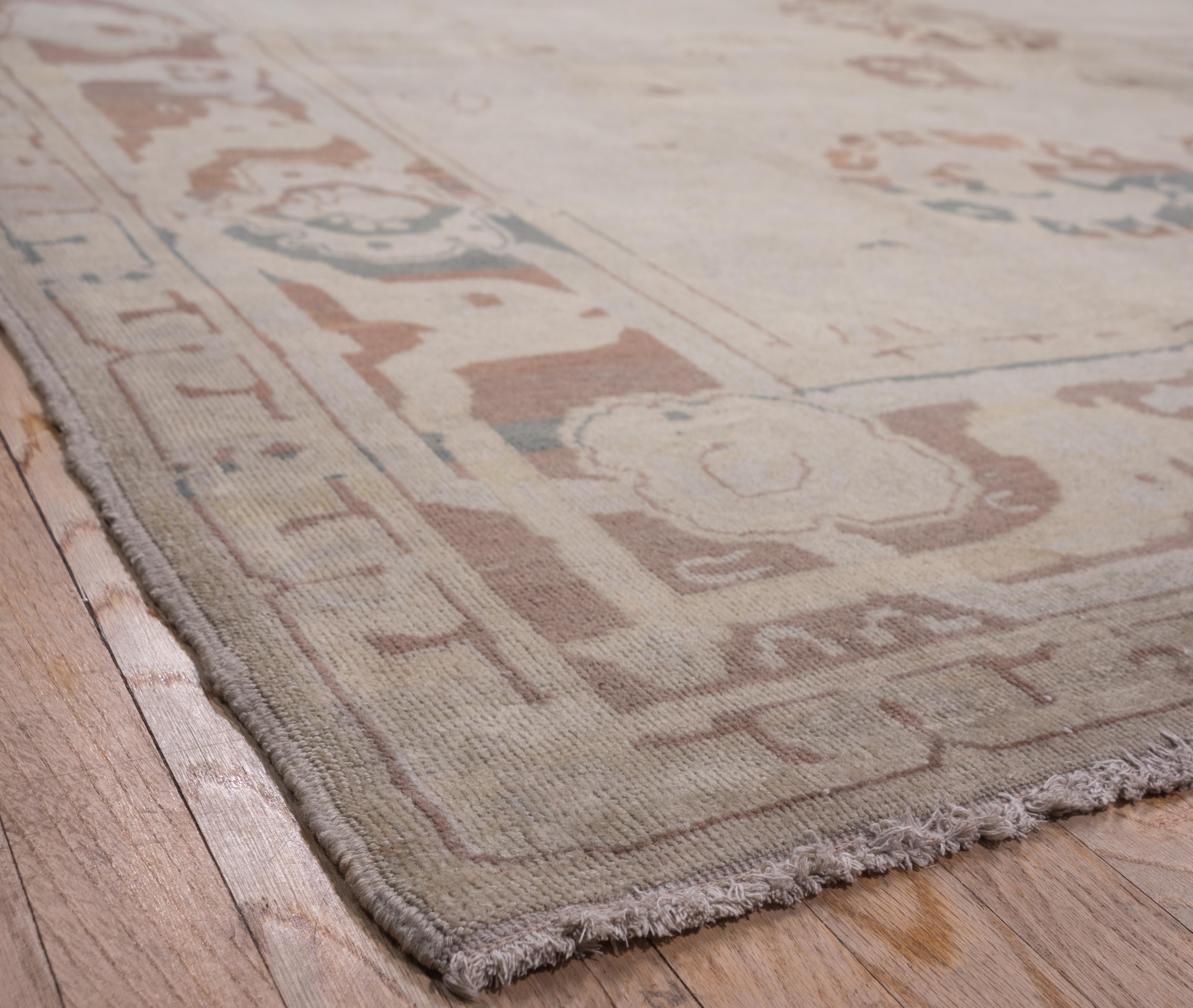 Early 20th Century Unusual Antique Turkish Oushak Carpet, Neutral Palette, Green Accents For Sale