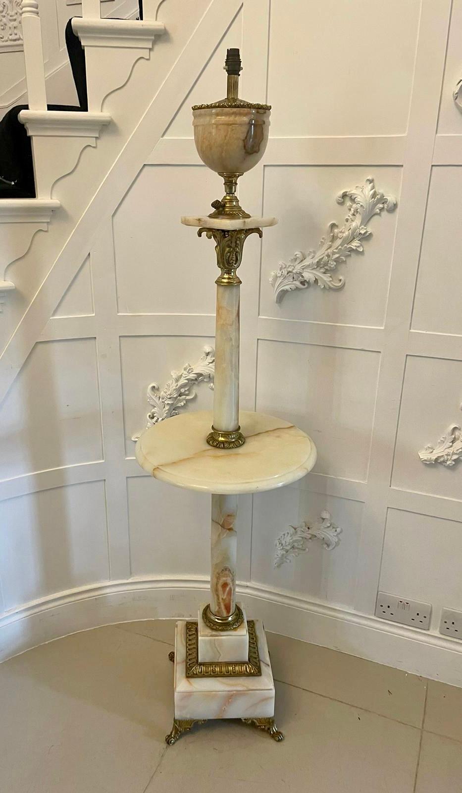 Unusual Antique Victorian French onyx and ormolu extending floor lamp having an extending top above a onyx turned column supported by a circular onyx top supported by a onyx column standing on a square stepped base with ornate ormolu mounts and