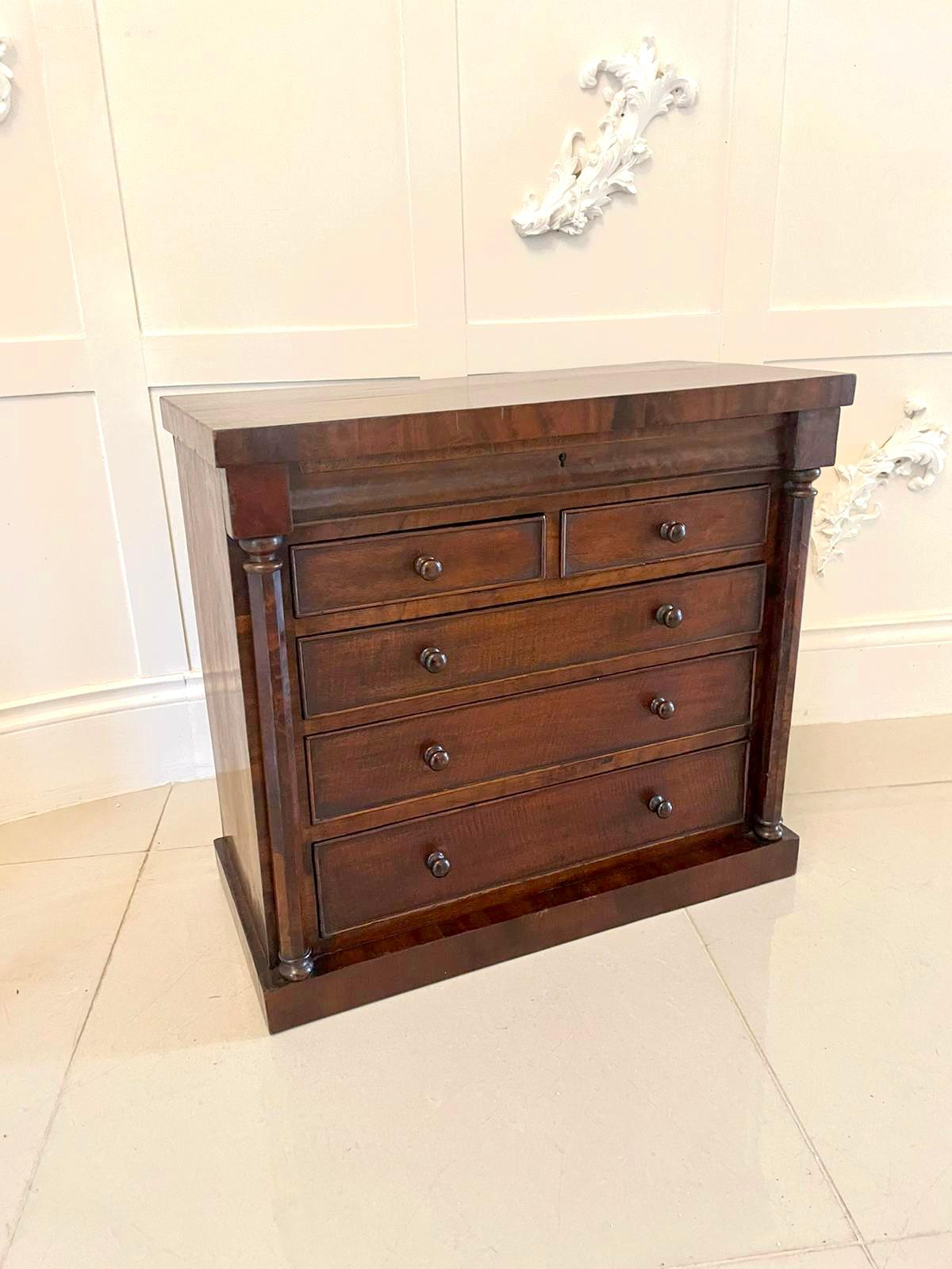 Unusual Antique Victorian miniature quality mahogany chest of drawers having a quality rectangular mahogany top above a shaped frieze drawer above two short and three long drawers with a cockbeeded edge and original turned mahogany knobs and flanked