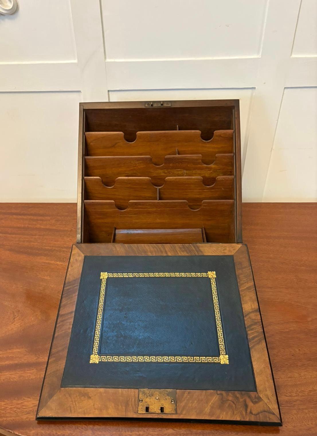 Unusual Antique Victorian quality burr walnut brass mounted stationery box
having a quality burr walnut slope front with ornate brass mounts opening to reveal a leather writing surface and fully fitted letter rack.

A splendid example in fabulous