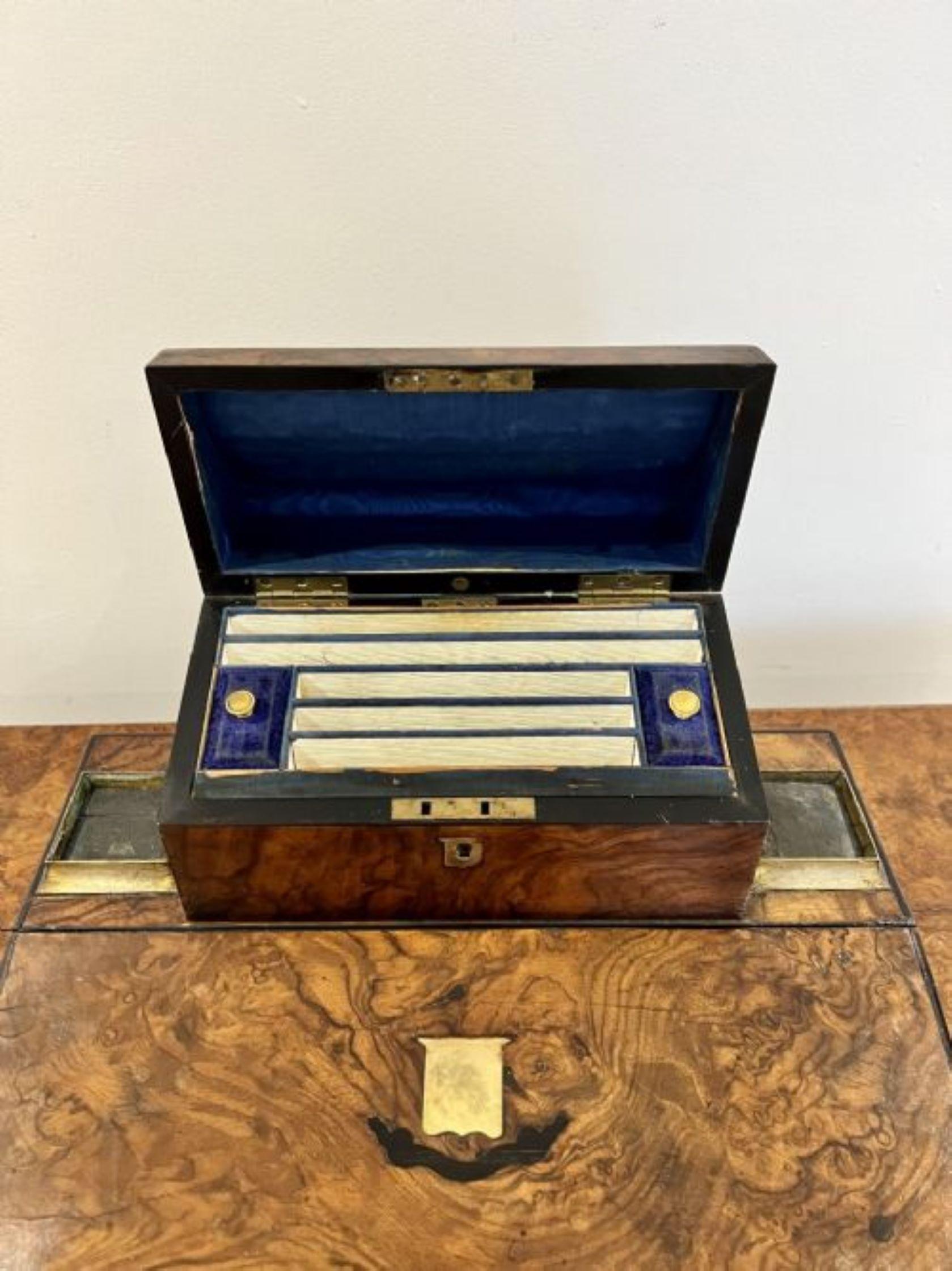 Unusual antique Victorian quality burr walnut writing box having a quality burr walnut writing box with an unusual shaped box to the top opening to reveal a fitted interior above a burr walnut flap opening to reveal a writing surface with blue