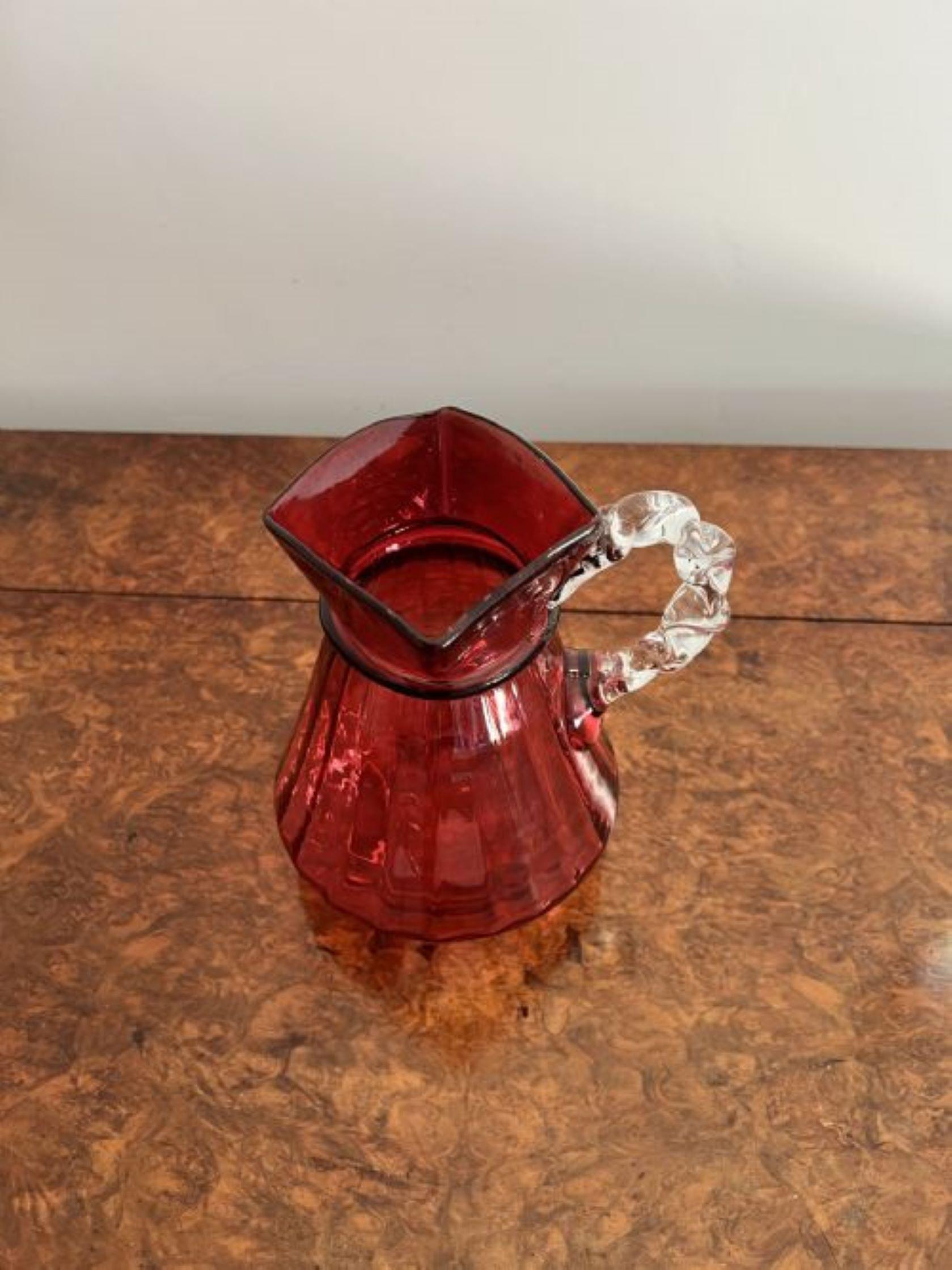 Unusual antique Victorian quality cranberry glass jug having an unusual twisted shaped handle to the back or side due to the unusual square shaped top.

