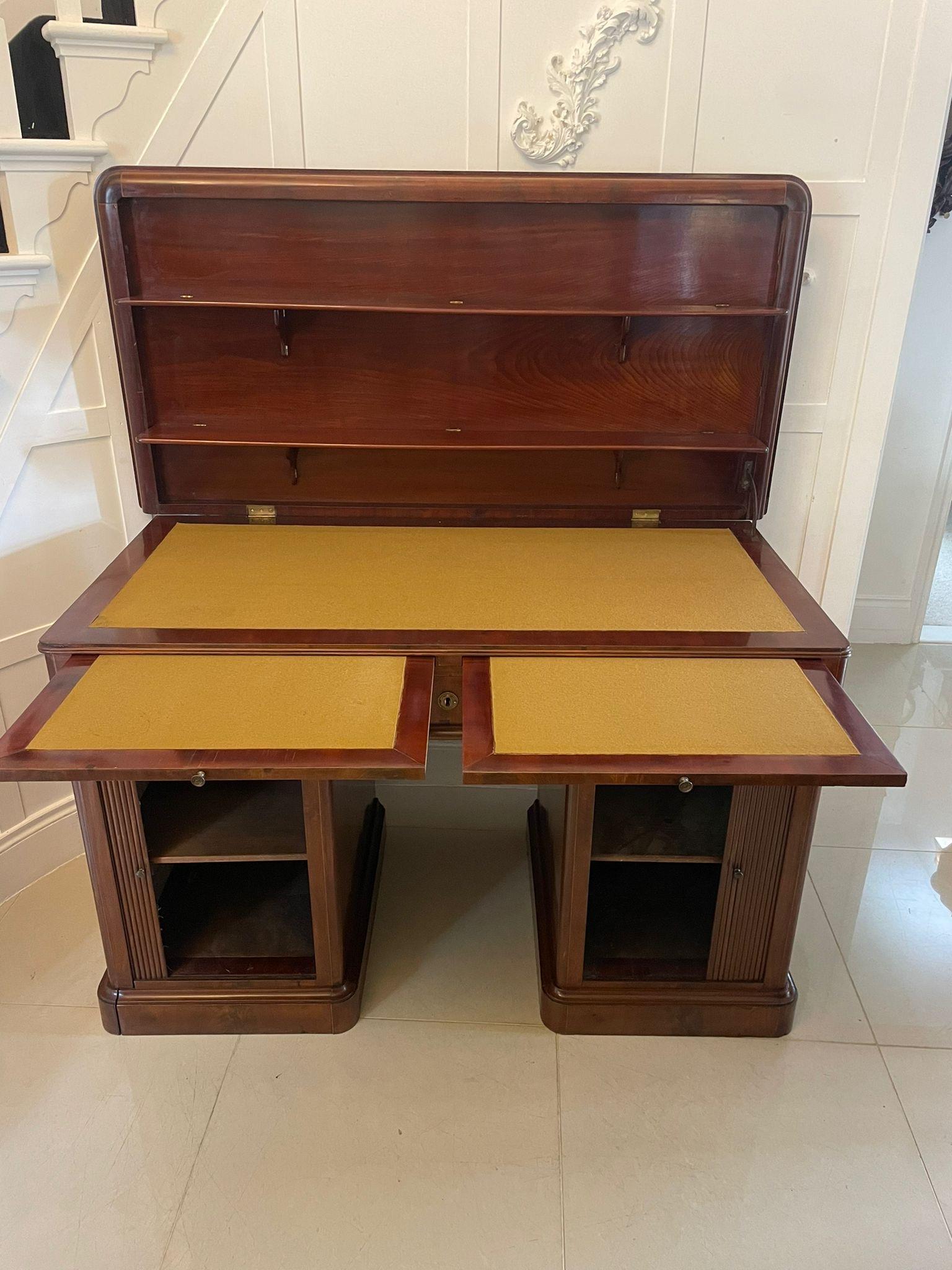 Unusual Antique Victorian quality figured mahogany kneehole architects desk having a quality figured mahogany lift up top opening to reveal a large writing surface crossbanded in mahogany, unusual double fold down display shelves above two pull out