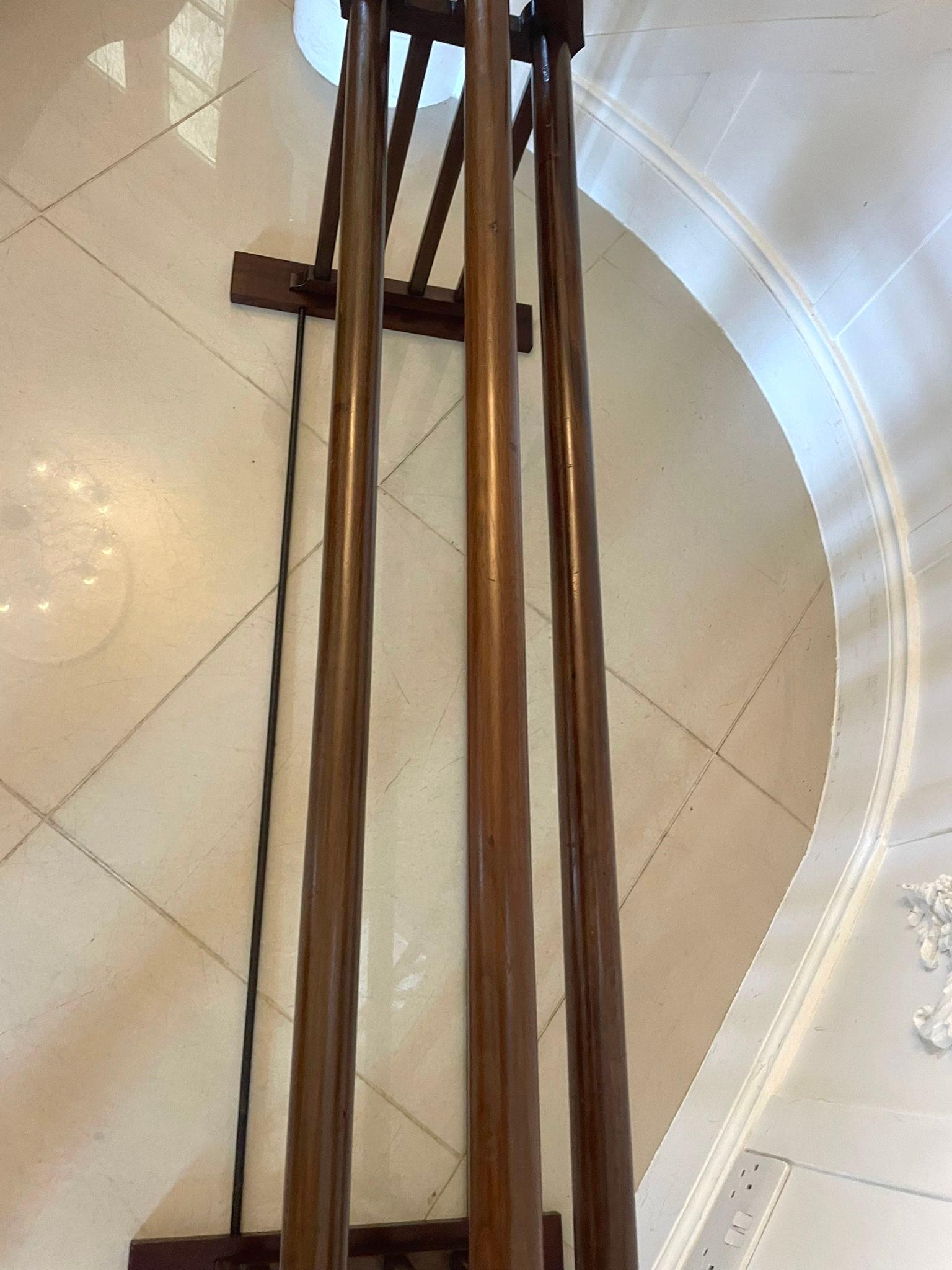 Unusual Antique Victorian quality mahogany saddle stand/rack having three long turned mahogany rails, mahogany arch top ends supported by eight mahogany square rails standing on mahogany flat feet united by two metal rods

A delightful quality