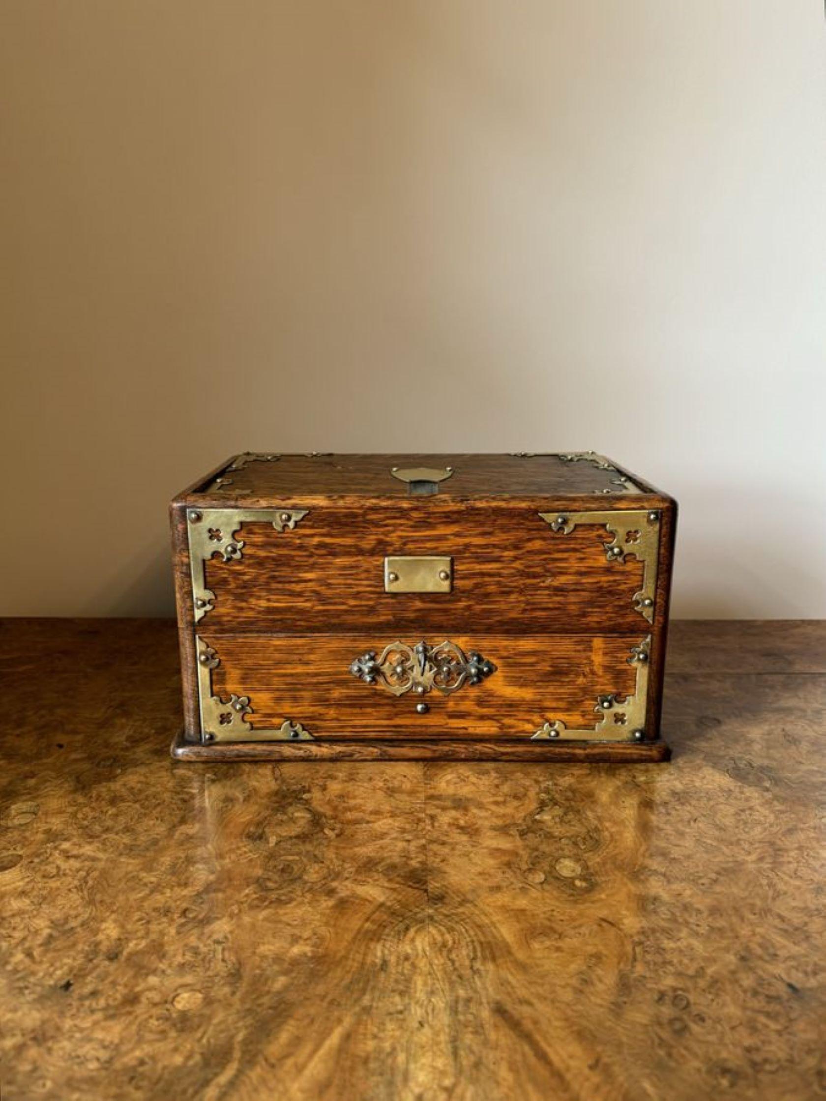Unusual antique Victorian quality oak and brass mounted box, having a quality oak and brass mounted lift up lid opening to reveal a storage compartment above a single drawer with the original brass handle. 

D. 1880