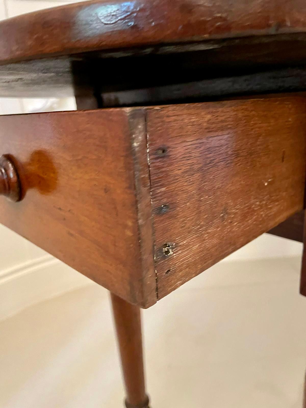 Unusual antique Victorian side table having an unusual solid walnut shaped top above an end frieze drawer standing on four elegant turned tapering legs 

A charming example of desirable proportions.

H 68.5cm
W 129.5cm
D 45cm
Date 1860.
 