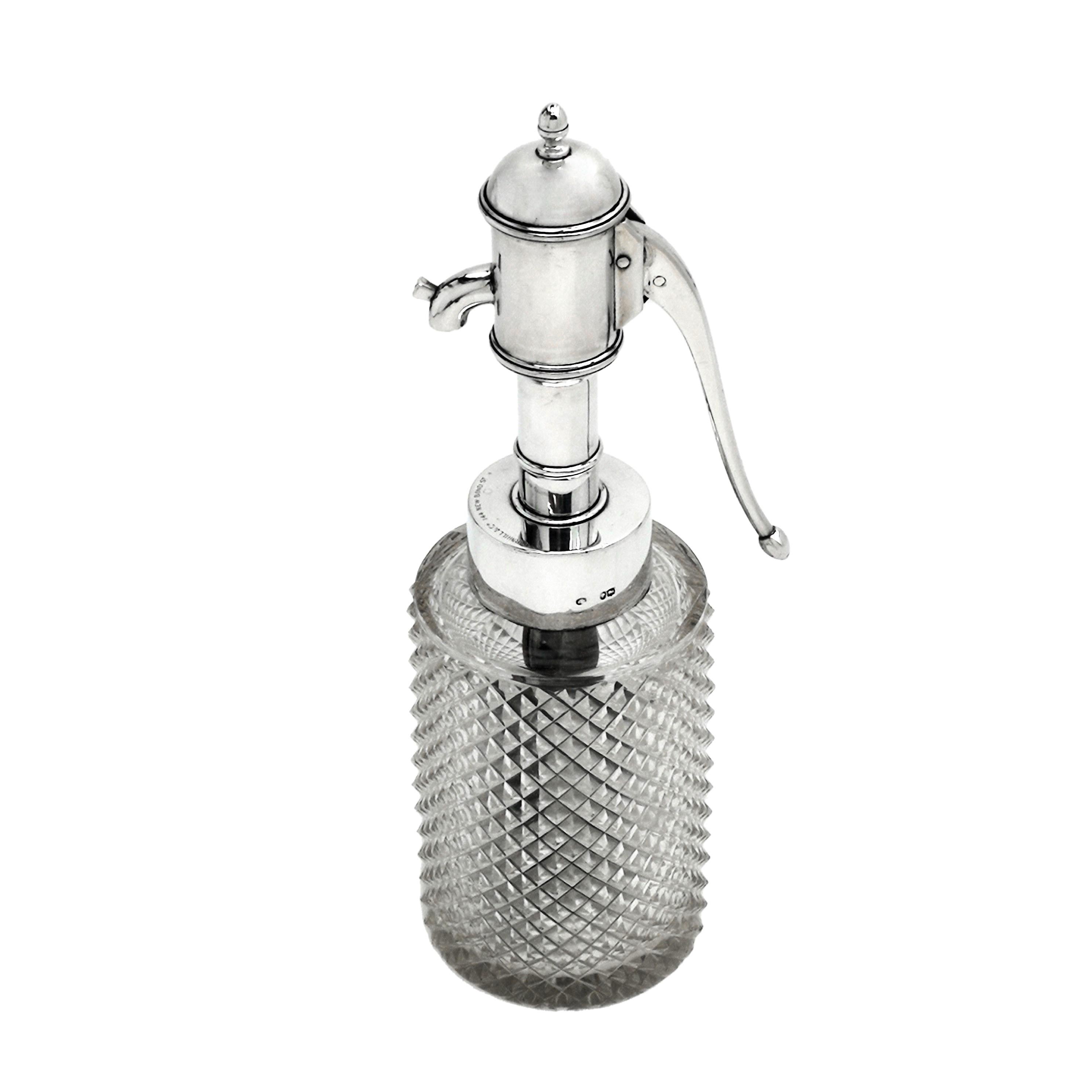 A novel antique Victorian Silver mounted Scent Bottle / Perfumer with a cut glass body. This unusual Scent Bottle is whimsically shaped as a water pump with a tall silver neck with a silver pump handle.
 
 Made in London in 1885 by E H Stockwell.
 
