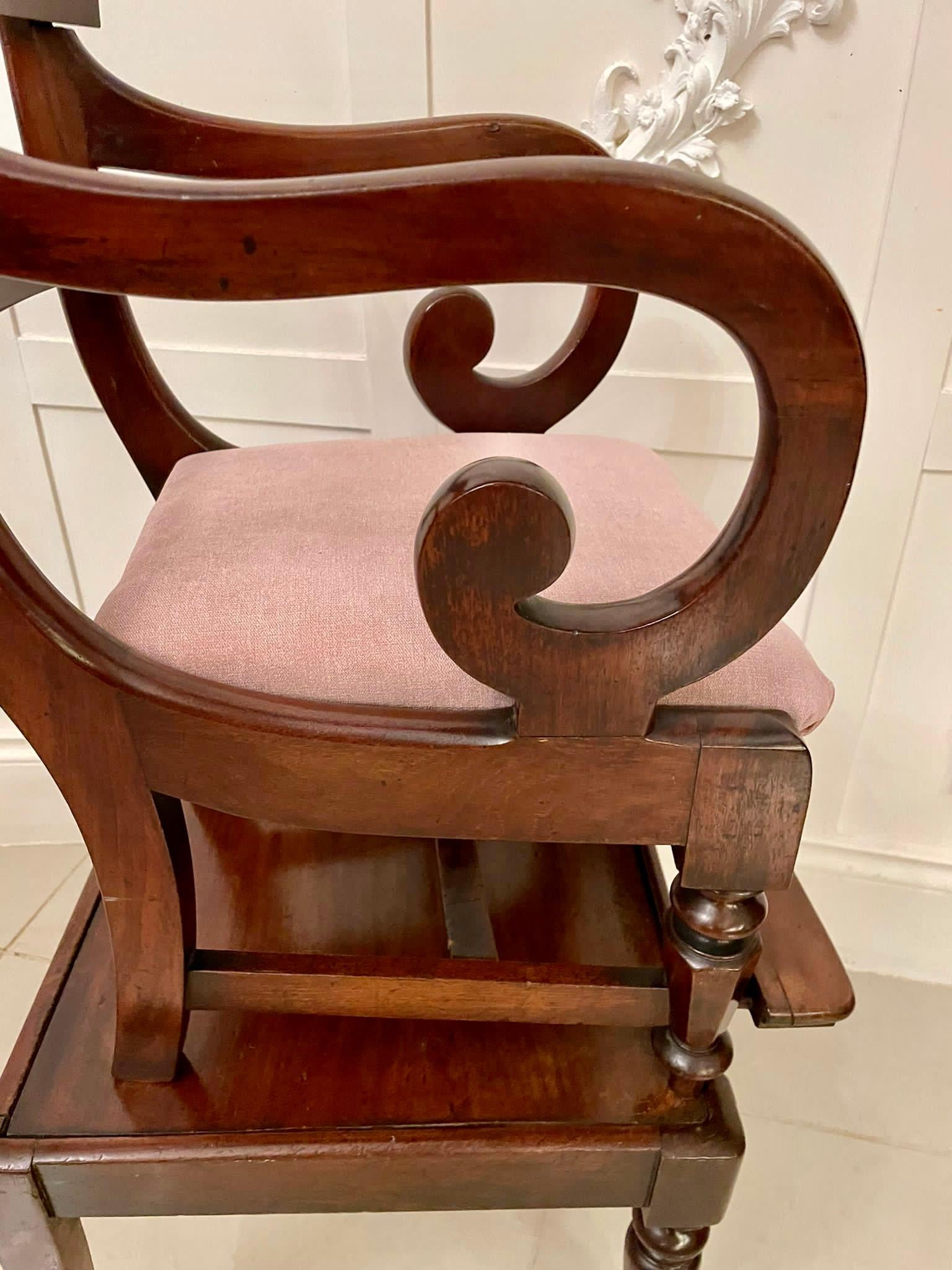 Unusual antique William IV quality mahogany child’s armchair and stand having a quality arched shaped top rail and splat to the centre of the back, shaped scrolled open arms, newly reupholstered drop in seat in a quality fabric standing on shaped