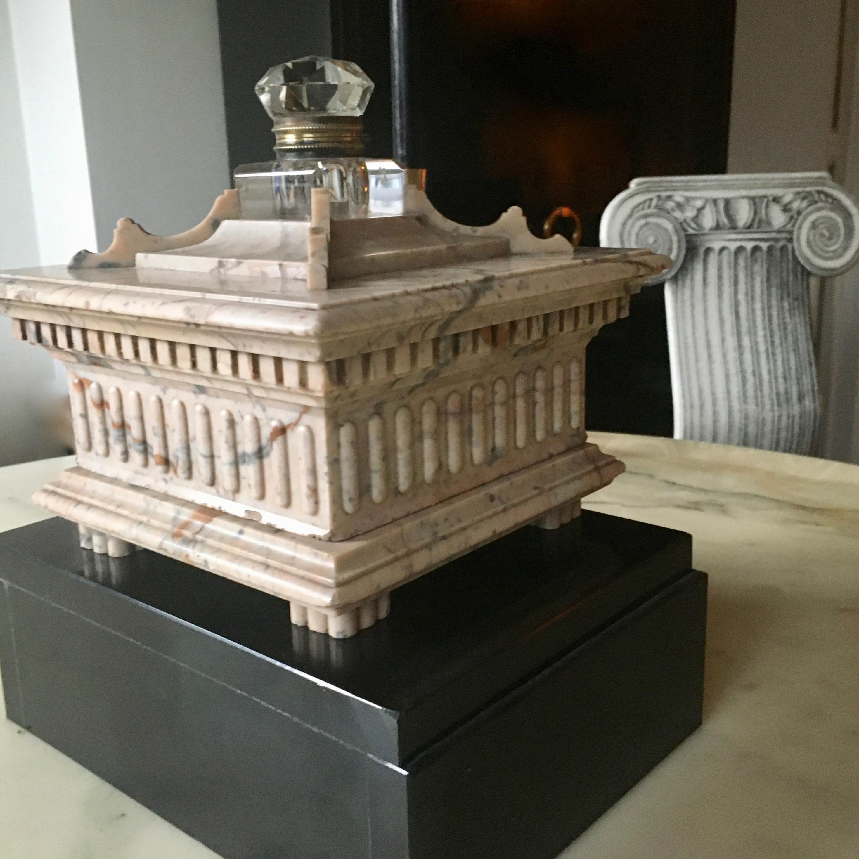 A cut crystal inkwell inserted in a massive architectural beige marble base.
Probably Italy around 1890.