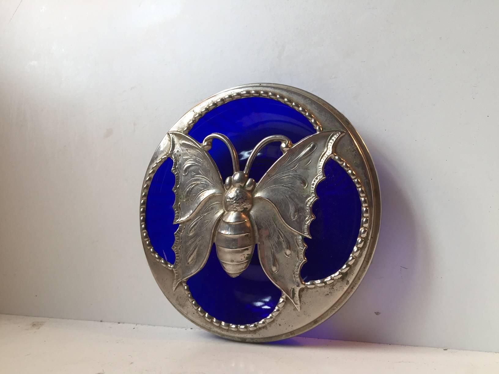 Art Deco cobalt blue glass vessel with piercet silver plated butterfly lid. It can be used as a Inscenter for Potpourri or alternatively an Ashtray. It was made in France by an anonymous Silversmith.