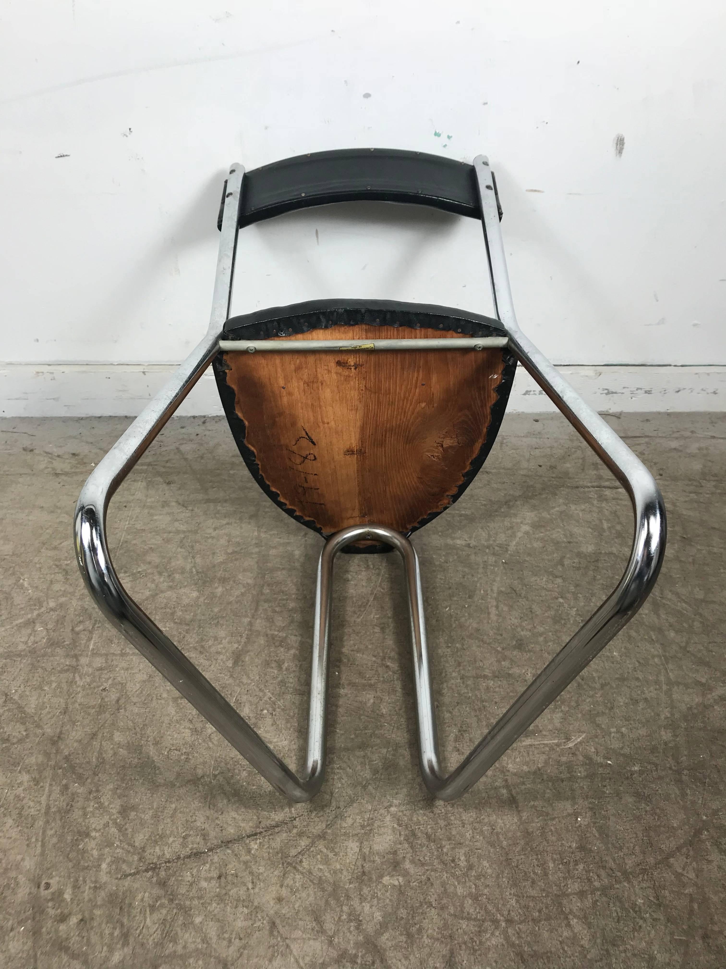 Unusual Art Deco Machine Age side chair / vanity stool designed by Gilbert Rhode for Troy Sunshade company, black oil cloth and tubular chrome. Amazing original condition, retains early Troy Sunshade label.