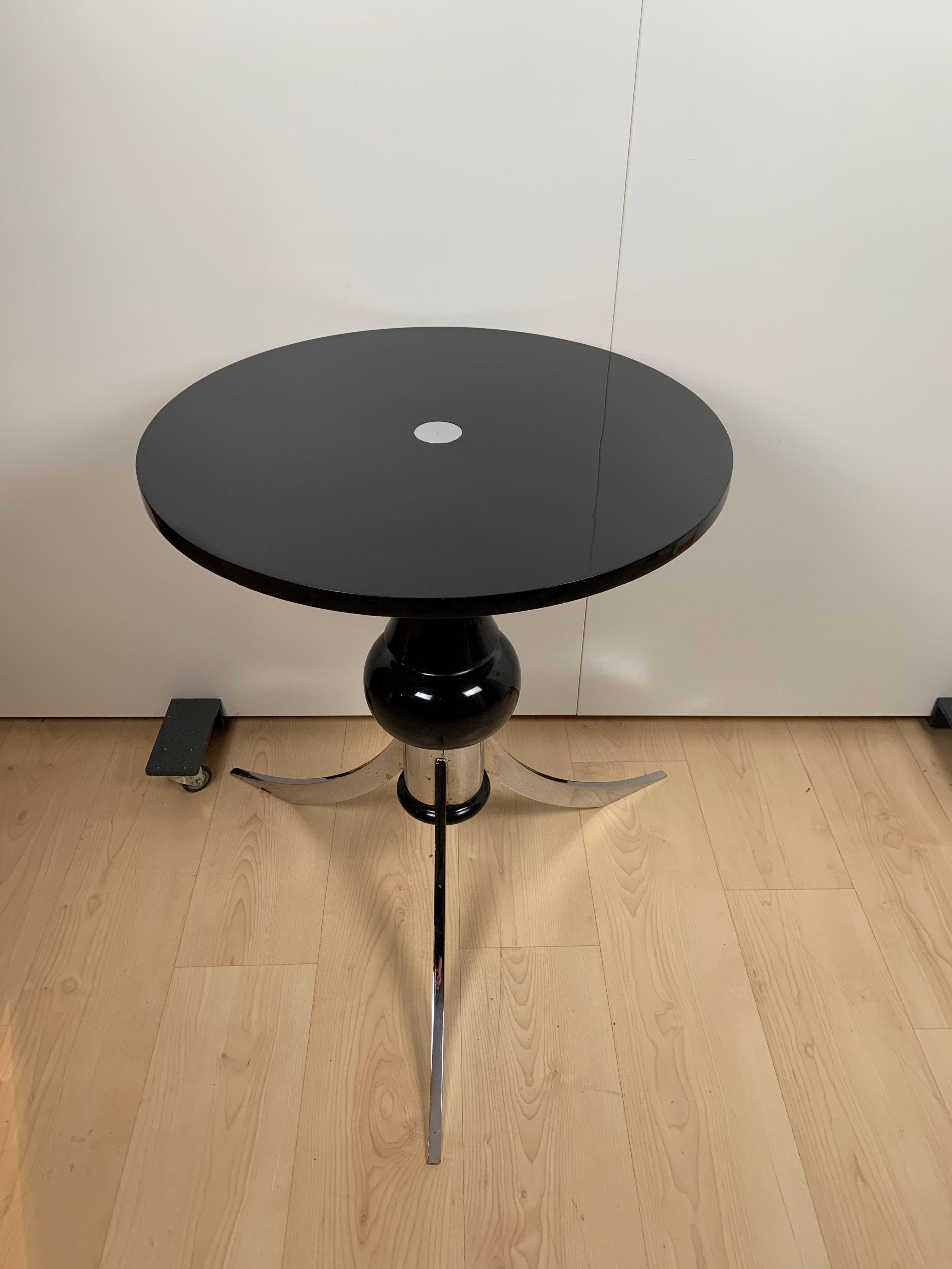 Extraordinary original Art Deco side or coffee table from France about 1930. Standing on three chrome-plated steel legs. Rotatable plate. Unusual shape similar to like a chess piece in its column. High-gloss black lacquered with original chrome