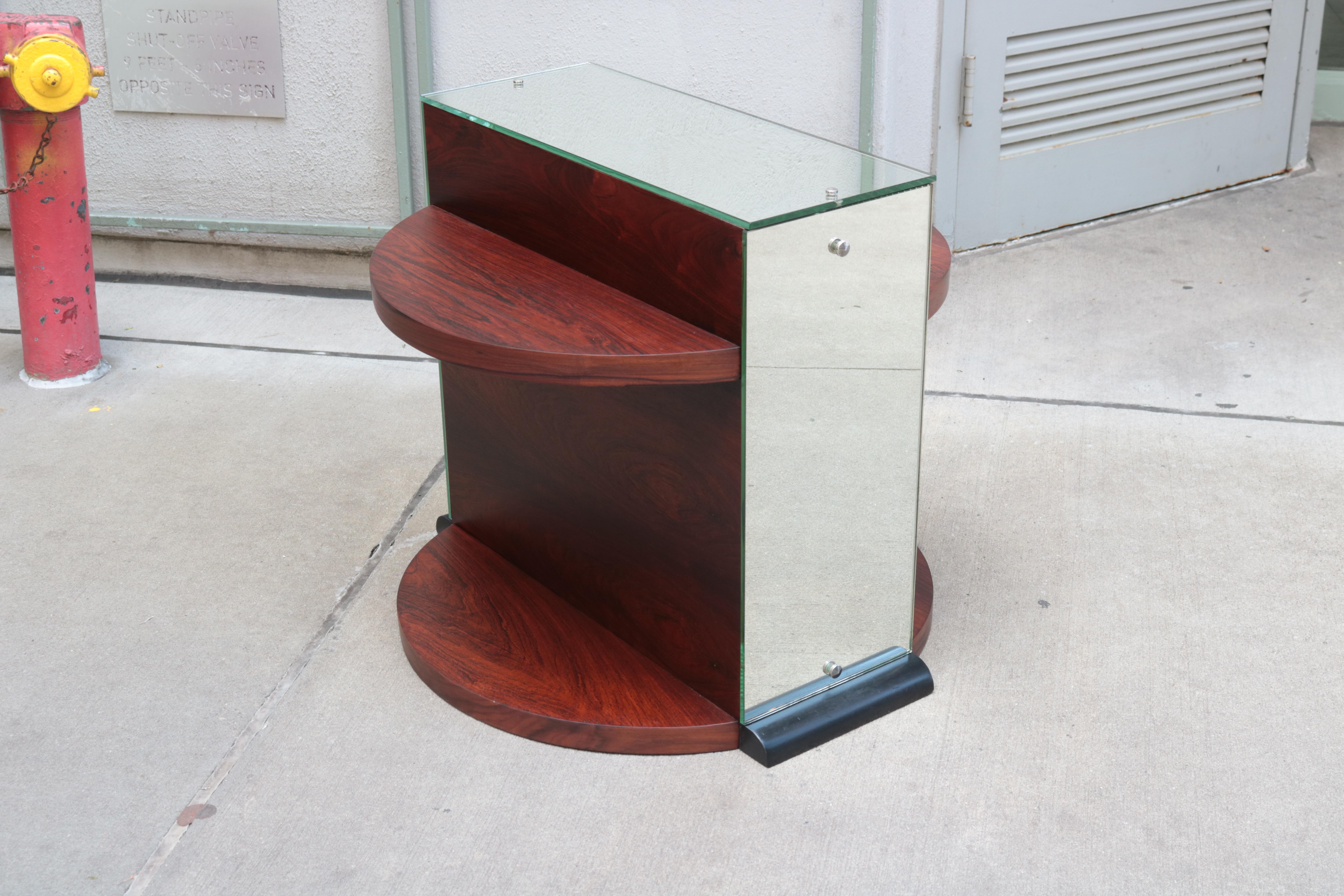 Unusual Art Deco side table. 
Mahogany and mirror glass.