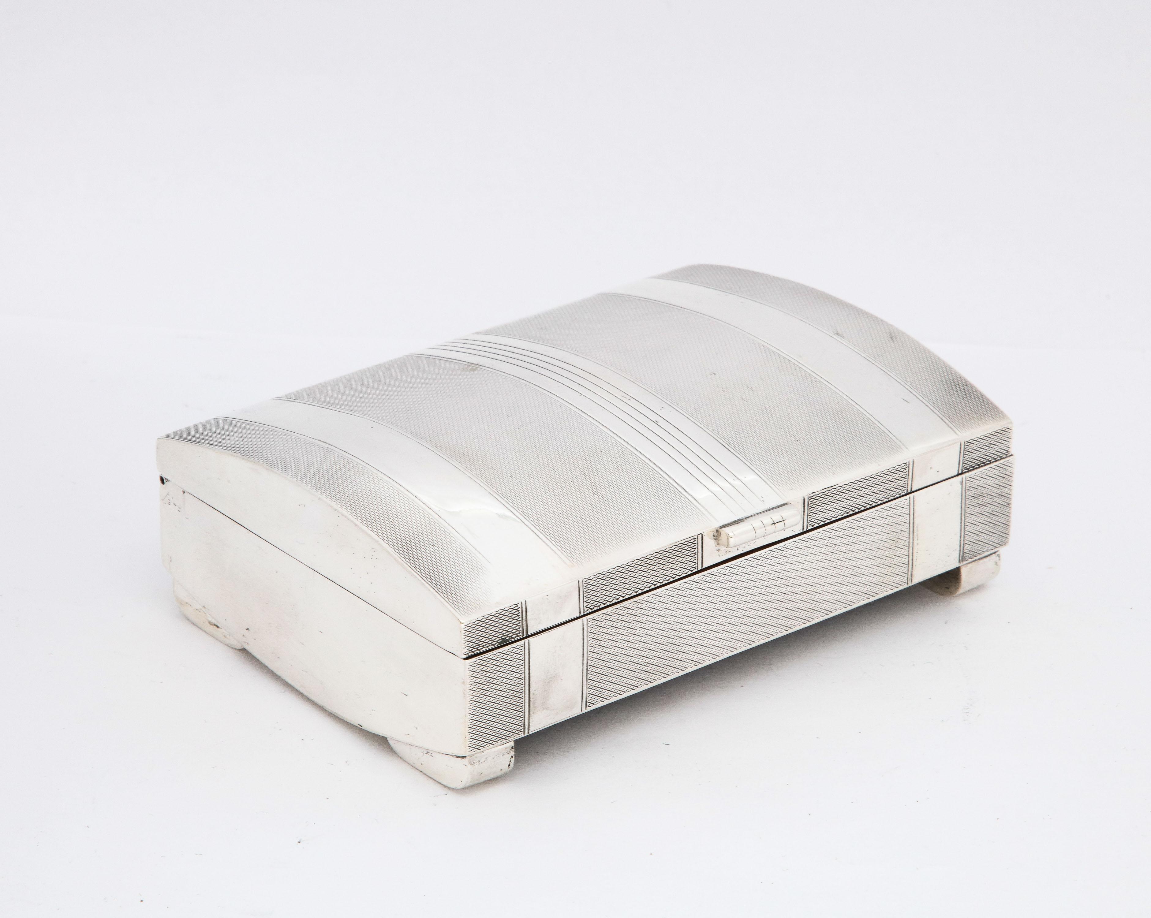 Unusual, rare, Art Deco Period, footed sterling silver table box with rounded, hinged lid, Birmingham, England, year-hallmarked for 1938, Hassett and Harper Ltd. - makers. Underside of box is all sterling silver; feet are elongated and rounded in