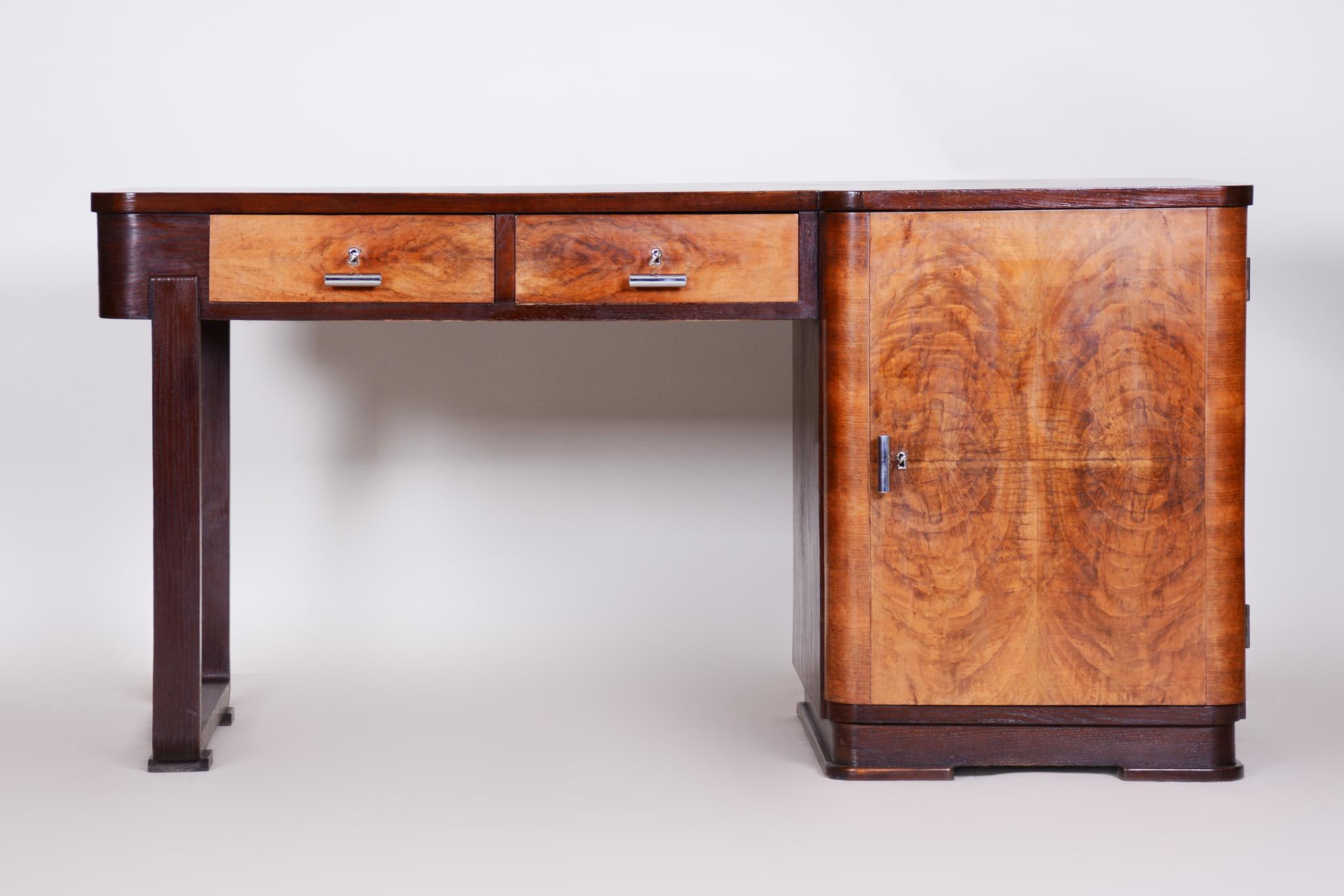 Restored Art Deco writing desk.
Unusual combination of oak and walnut veneer.
Chrome-plated steel handles.
Source: Czechia (Czechoslovakia)
Period: 1930-1939.
 