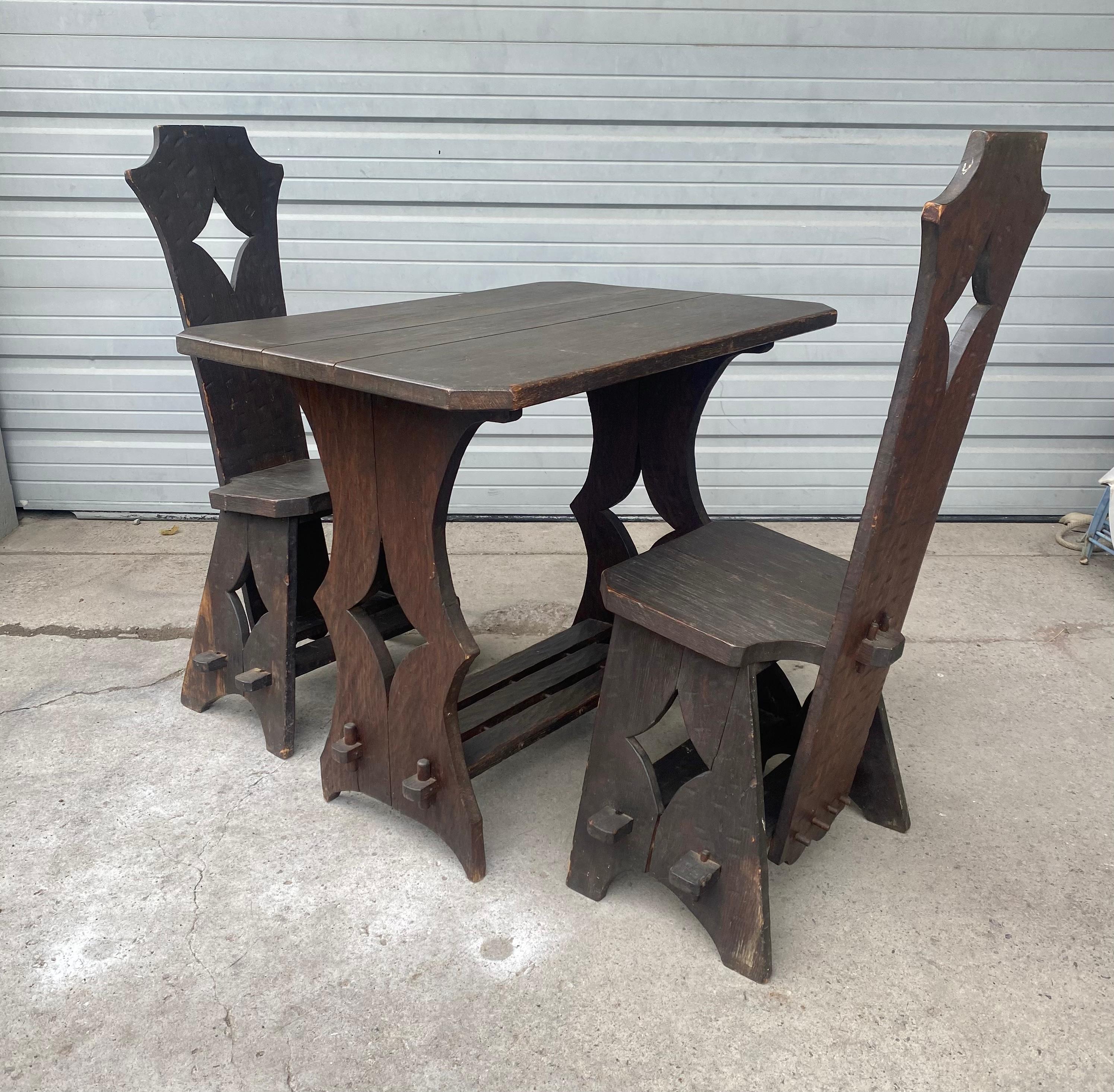 Unusual  Arts and Crafts Pub / Bistro Table and Chairs manner of Limbert..All hand pegged,,dowelled.. Charming set.. Perfect for small little nook in the kitchen,, sun-porch,,etc.. Hand delivery avail to New York City OR anywhere en route from