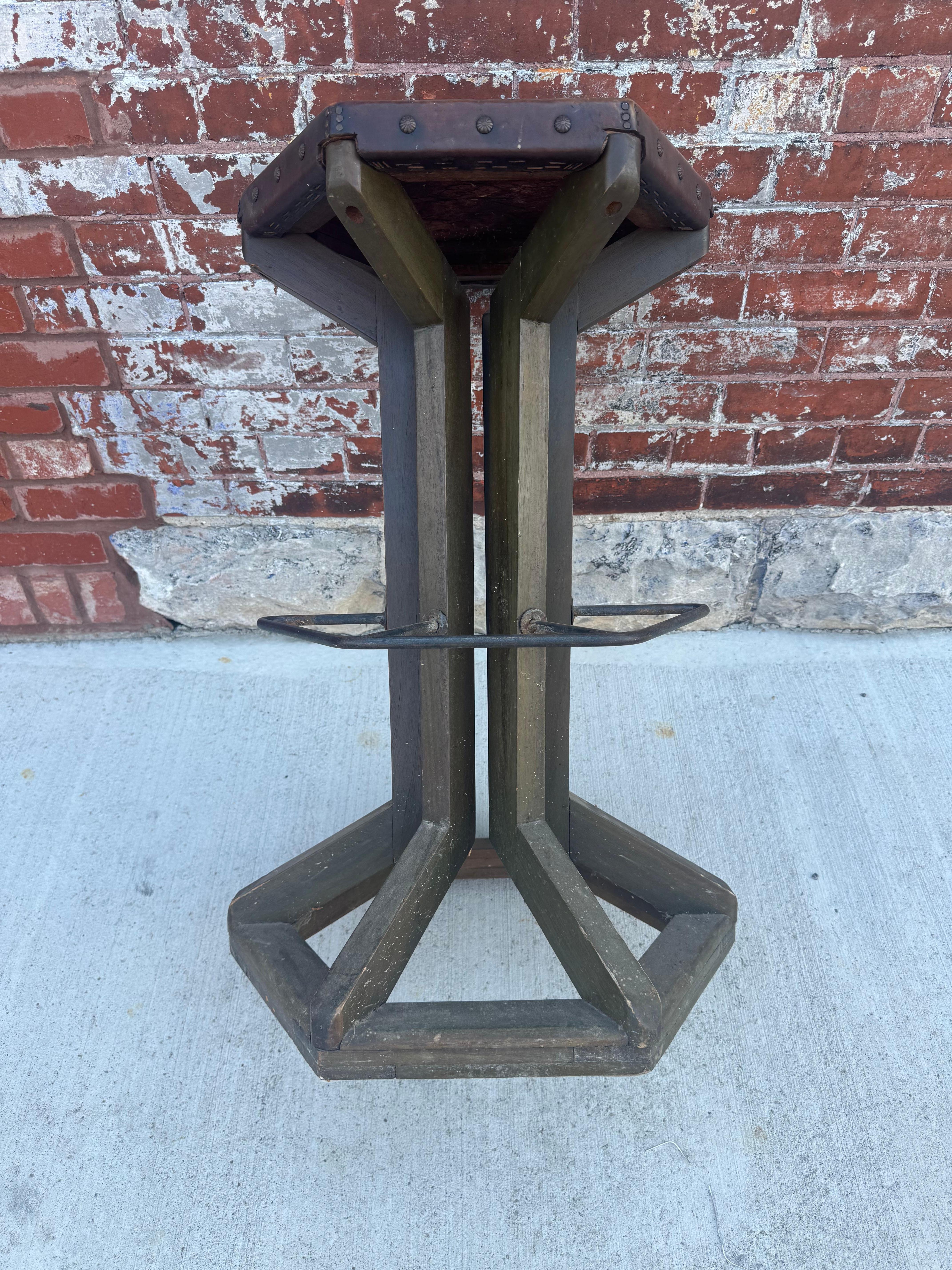 Unusual Arts and Crafts / Industrial Stool, manner of Frank Lloyd Wright.. Original Hexagon shape Leather Seat with brass tacks.. iron foot rest, Retains amazing original green finish /patina. Stunning, piece of art , sculpture