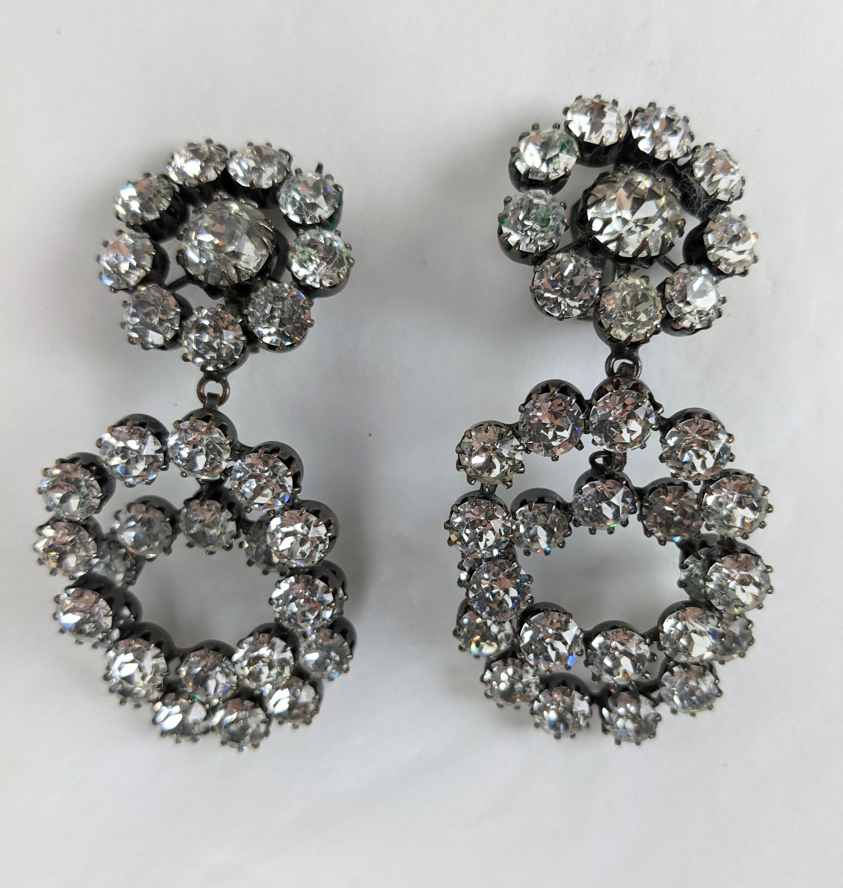 High quality unusual Austrian Crystal Hoop Earrings from the 1960's. 2 large crystal studded hoops fall independently from a crystal cluster with clip back fittings. Large and striking effect. 
3.5