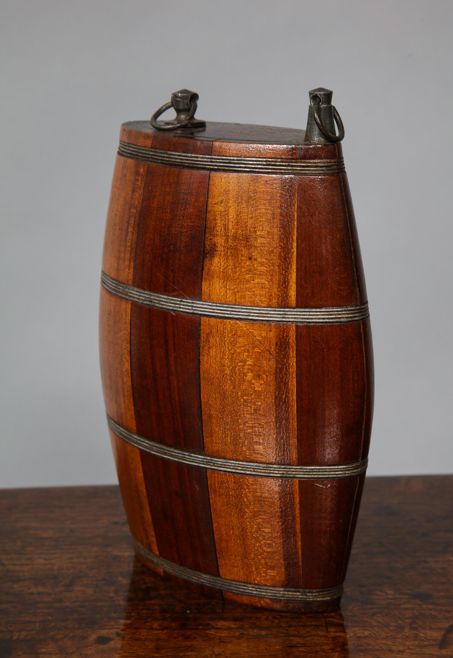 An unusual mid-19th century iron bound mixed mahogany and birch barrel from spirit flask, Scottish, circa 1860.

Treen